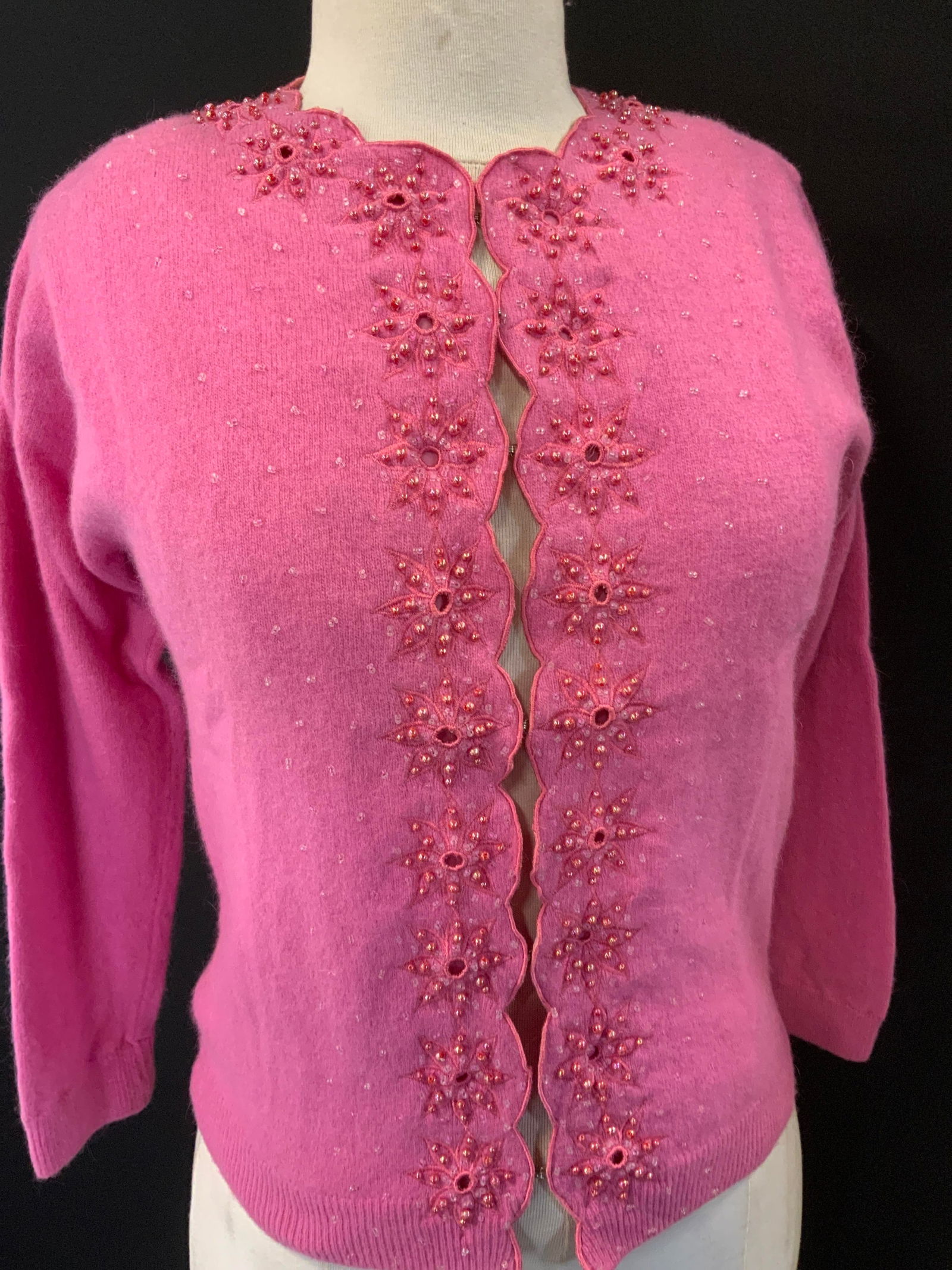 Ricky Bo Hand Beaded Cashmere Cardigan 1960s: Vintage cardigan , c. 1960s by designer Ricky Bo. Bright pink with pink embroidered and hand beaded with iridescent pink beads. Vintage Size 38 . Made in Hong Kong. Vintage cashmere cardigan with nylo