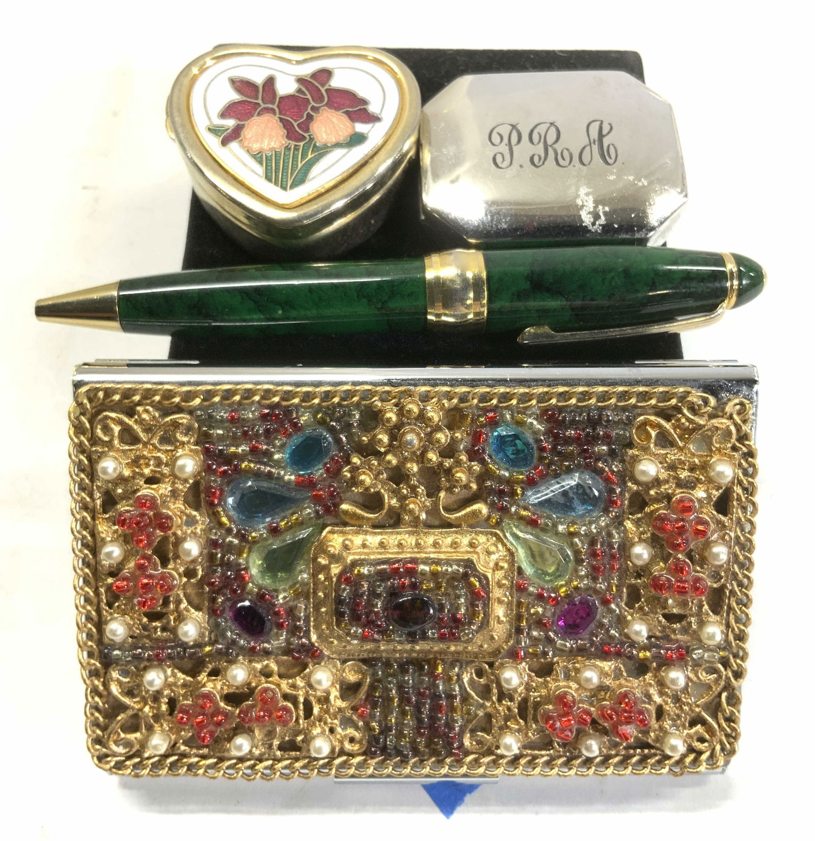 4 Pill Boxes, Pen, Hand Craft Business Card Holder: Lot of 2 hinged pill boxes. Heart shape enamel , snaps closed. 1.5 x 1/2 in deep. Silver tone hinged pill box with monogram P.R.A. Green marbles ball point pen , 4.5 in. L. Business card metal case wi