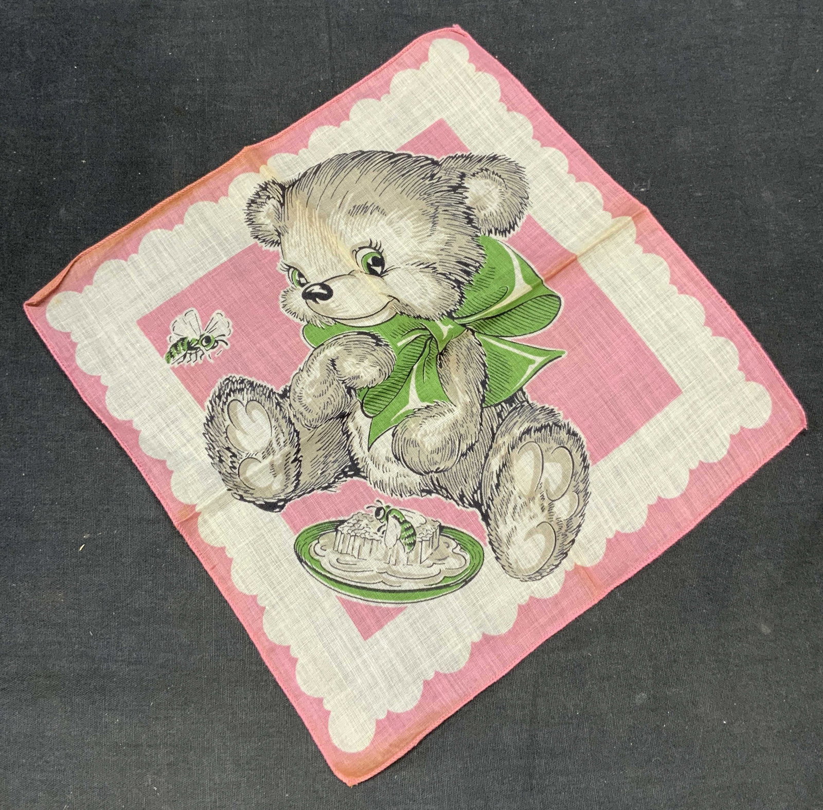 Vintage Pink Cotton Teddy Bear Handkerchief: Vintage pink and white handkerchief with teddy bear and bee motif. Material feels like cotton. Measures approx. 9.25 x 9 inches. Some wear to material including blemishes observed. Handkerchief, vinta