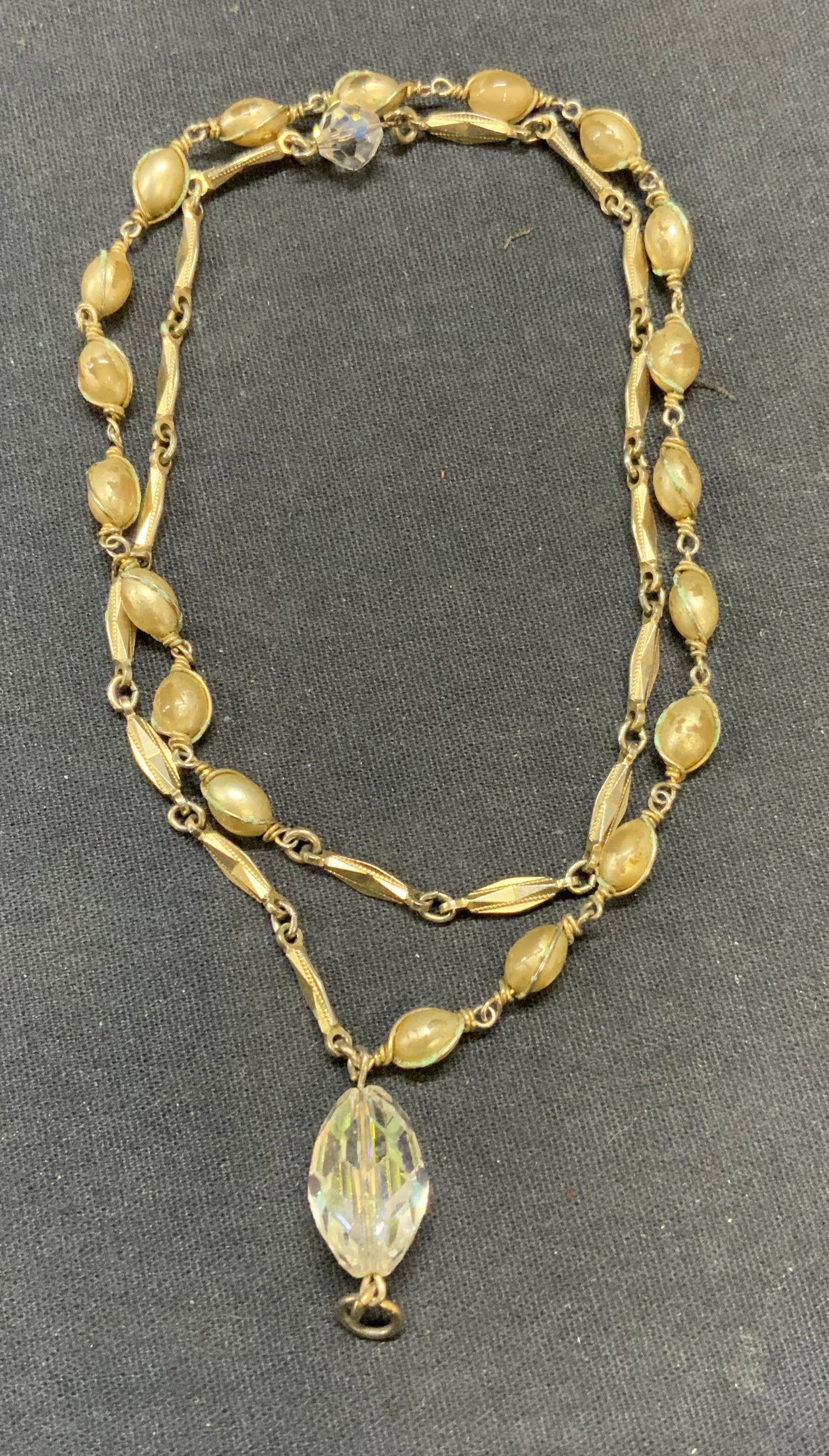 Vintage Gold Tone Beaded Crystal Necklace: Vintage gold tone beaded necklace with colorless crystal accents. Drop length approx. 11 inches. Some surface wear including scratching observed. Estate jewelry, costume jewelry, cocktail jewelry, fas