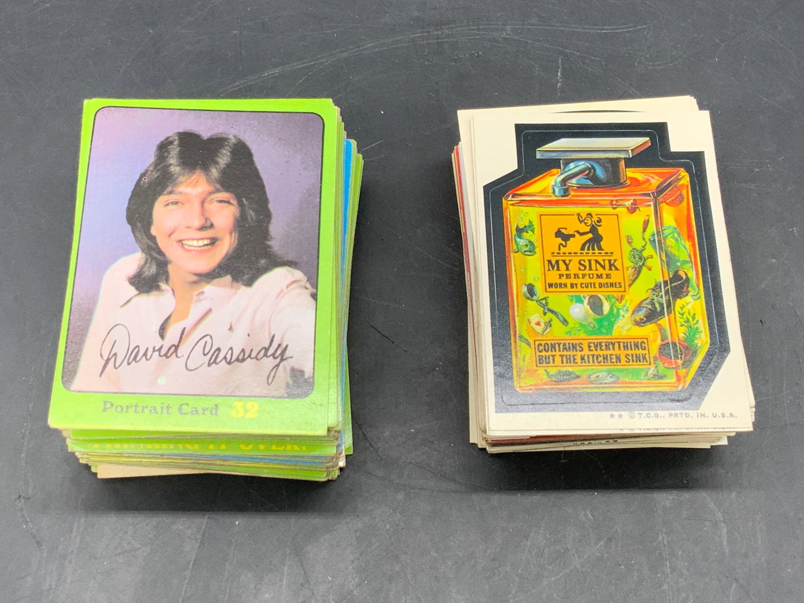 Group Vtg Partridge Family Cards & TCG Stickers: A group lot of vintage early 70s Partridge Family Collectors Cards and early 70s TCG Wacky Packages stickers. Partridge Family Cards measure approx. 3.5L x 2.5W in. Pieces have some wear consistent wi