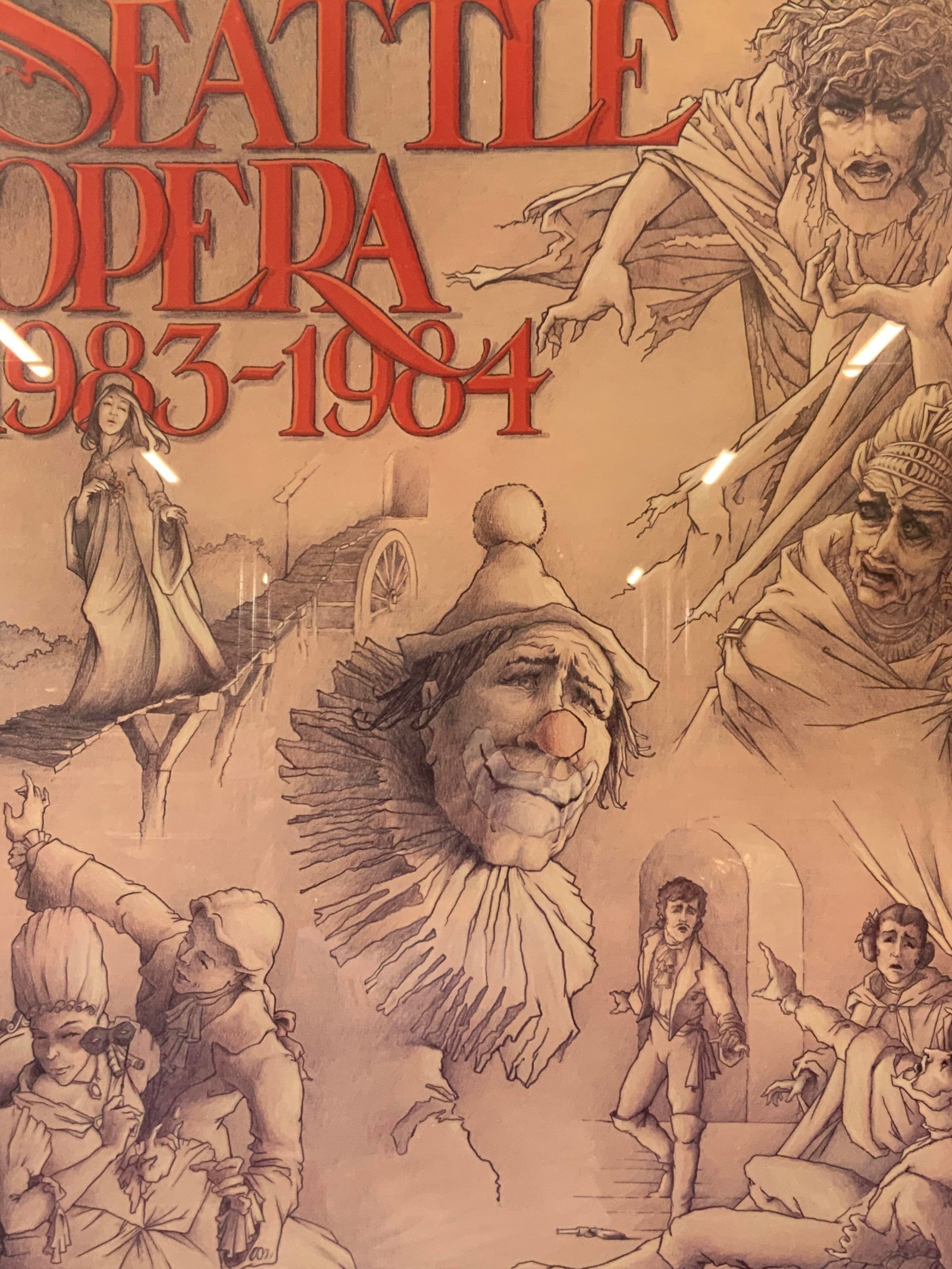 Seattle Opera 1983-4 Anniversary Litho: Seattle opera, 1983-4 20th Anniversary litho depicting the various figures from the operas of the year. Framed in an orange toned metal frame. Approx 3ft x 2ft. Window measures 35 x 23 inches. Moderat
