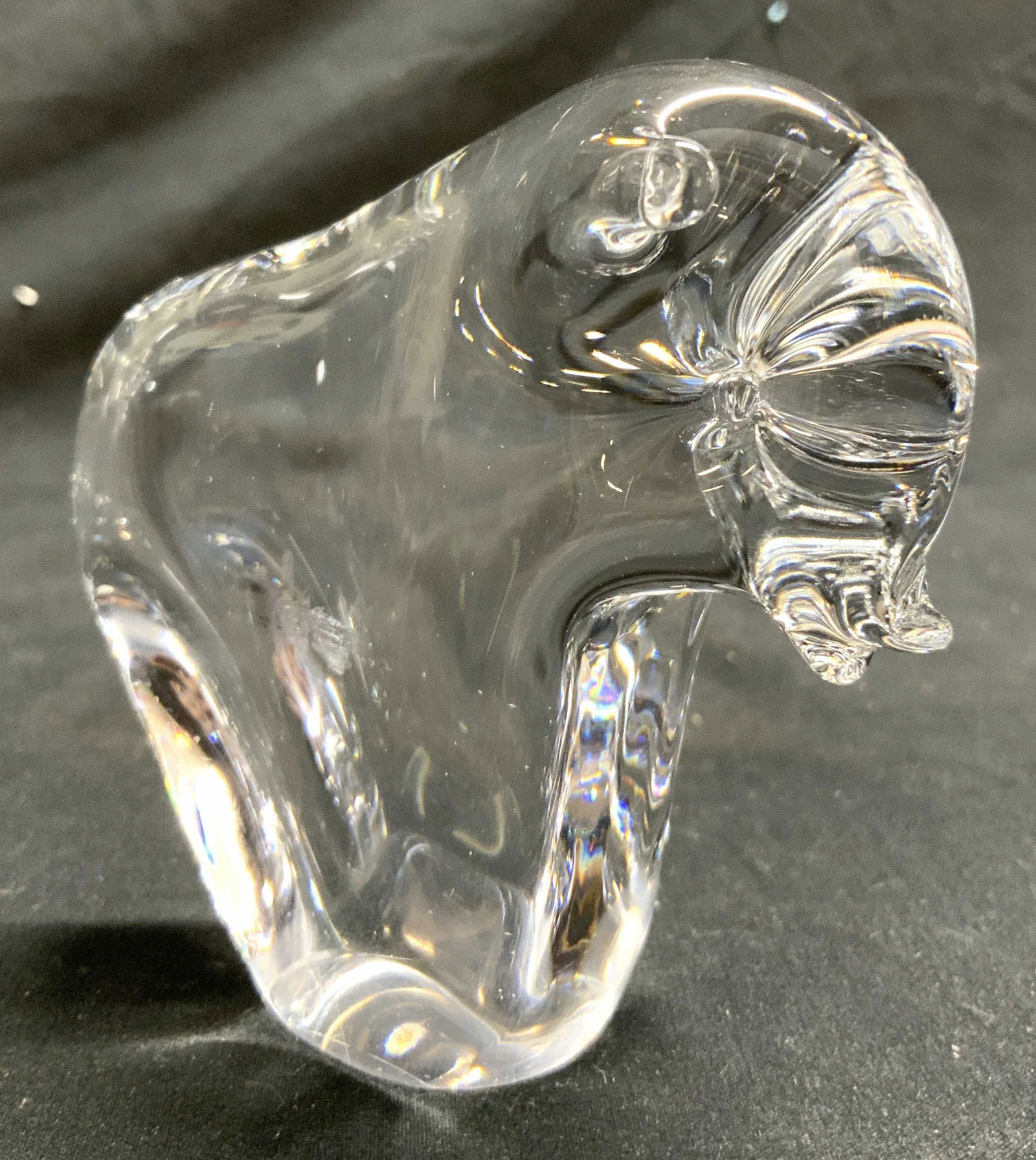 Crystal Buffalo Figure Paperweight Tabletop Decor: Buffalo figure paperweight appears to be crystal. Piece has facial detail and small tail structure on backside. Piece measures approximately 3.25 inches tall 4 inches deep 1.75 inches wide. Buffalo, c