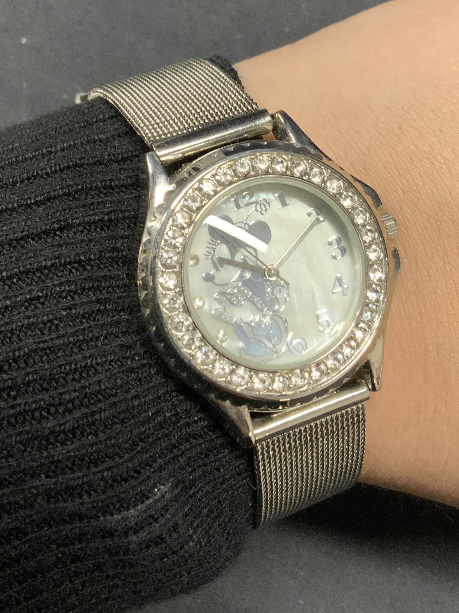 Disney Minnie Mouse Silver Tn Crystal Watch: Disney Minnie Mouse motif silver tone stainless steel watch with crystal decorated face. Silver tone mesh chain strap. Measures approx. 8.5 inches long. Not tested for function. Some surface wear incl