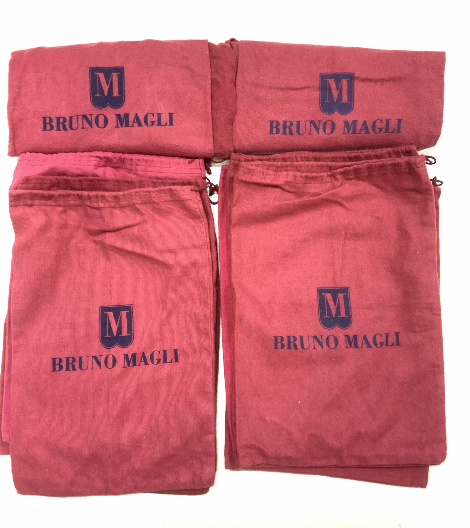 Group Bruno Magli Flannel Shoe Bags, 17: Signed Bruno Magli felt shoe bags/ duster bags with draw string closure. Light burgundy with navy lettering. Measures 9x13.5 in. Travel Shoe Bags, Luxury Designer Bruno Magli Flannel shoe Dust bags, u