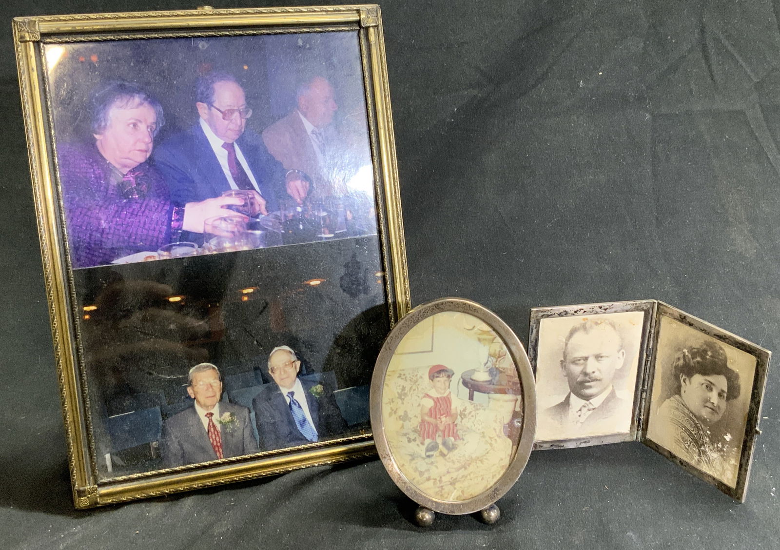 STERLING SILVER & Gilt Metal Picture Frames: Lot includes 1 folding picture frame and 1 oval picture frame, each test positive for sterling with PuriTEST tester. Lot also includes standing gilt metal picture frame. Largest Frame measures approxi
