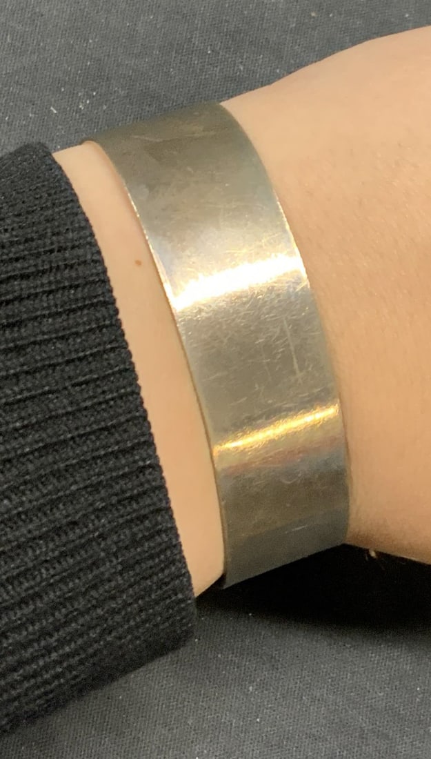 Vintage K. I. M. Sterling Silver Cuff Bracelet: Vintage K. I. M. Signed sterling silver cuff bracelet. Measures approx. 2.5 inches wide. Total weight .94 ozt. Signed to interior. Marked sterling. Some surface wear including scratching and bending o