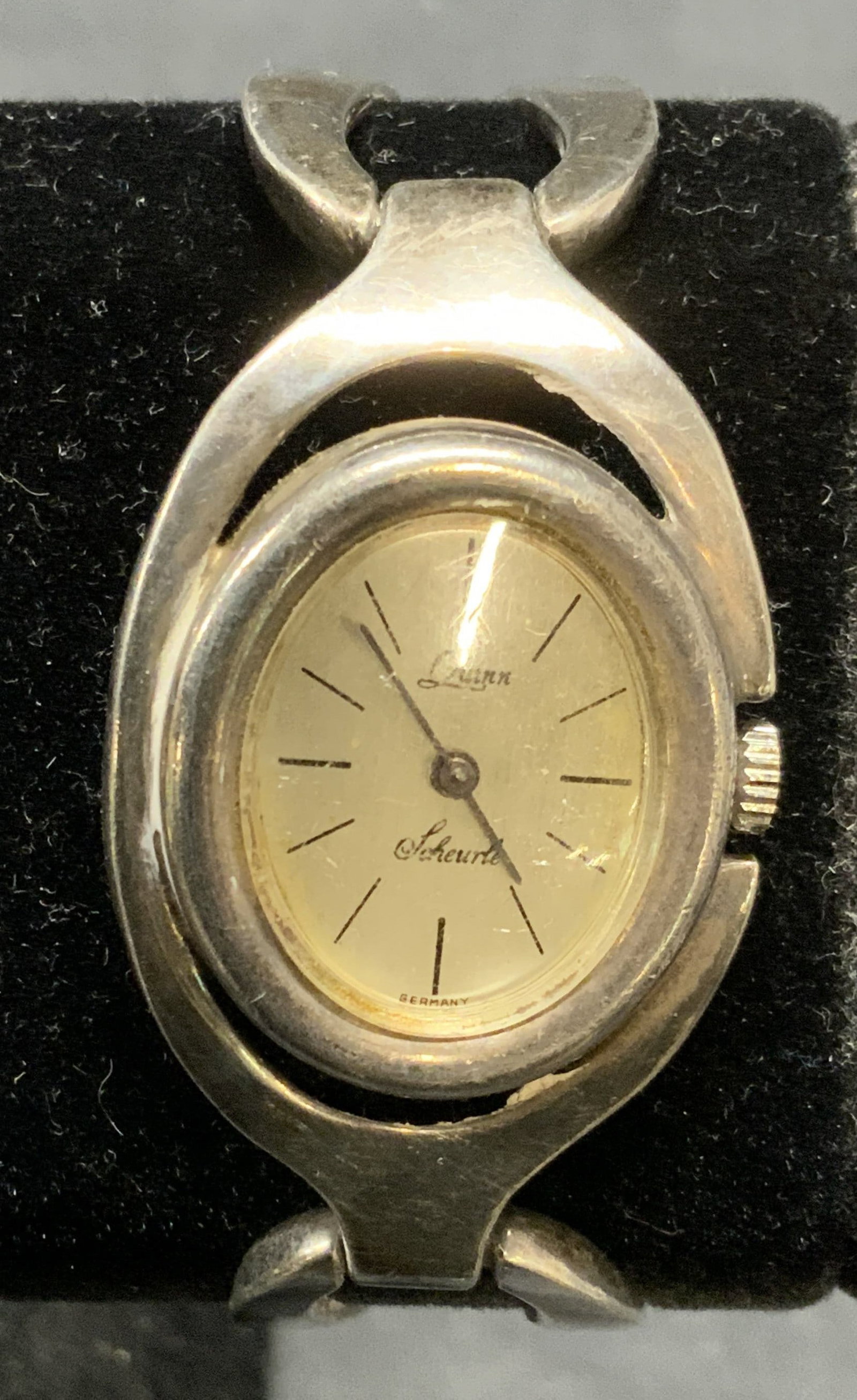 Vintage Quinn Scheurle Sterling Silver Watch: Vintage Quinn Scheurle sterling silver watch with bracelet strap. Signed on face and marked 925. Made in Germany. Measures approx. 2.5 inches wide. Total weight 53.3 grams. Some surface wear including