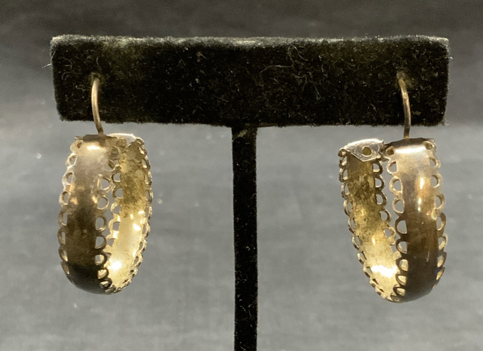 Vintage Sterling Silver Hoop Earrings: Vintage sterling silver hoop earrings. Measure approx. 1 1/8 inches wide. Test for sterling using PuriTEST kit. Total weight .25 ozt. Some surface wear including scratching observed. Estate jewelry, f