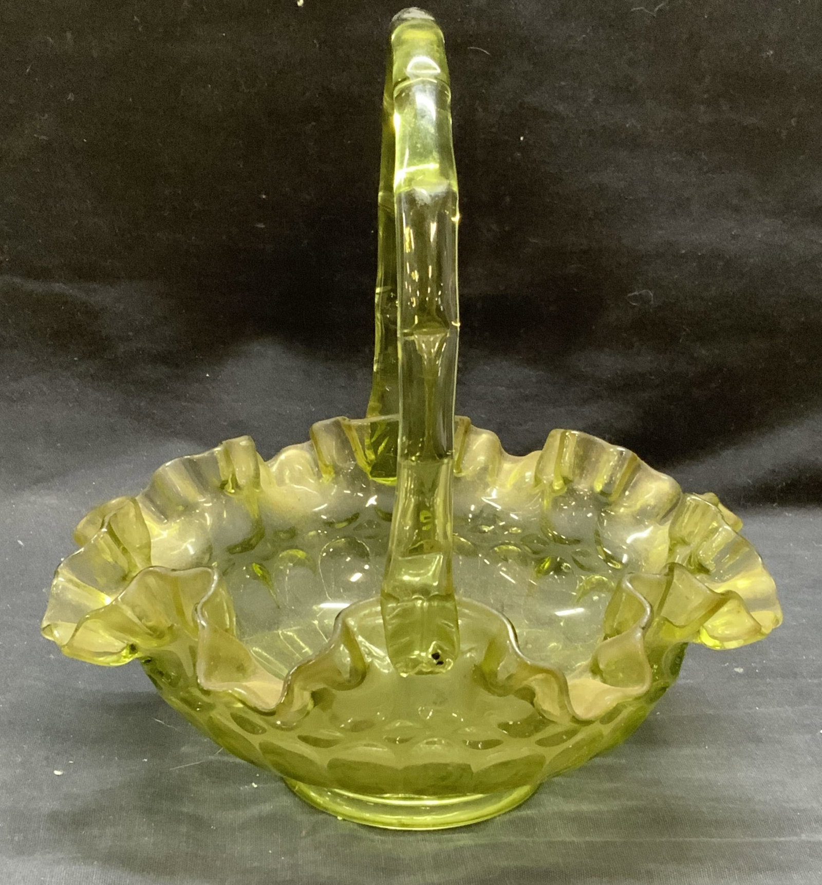 Vintage Green Art Glass Basket: Vintage green art glass basket with handkerchief rim. Measures approx. 8.25 x 9 inches. Some surface wear including scratching observed. Art glass, art glass basket, green basket, glass basket, collec