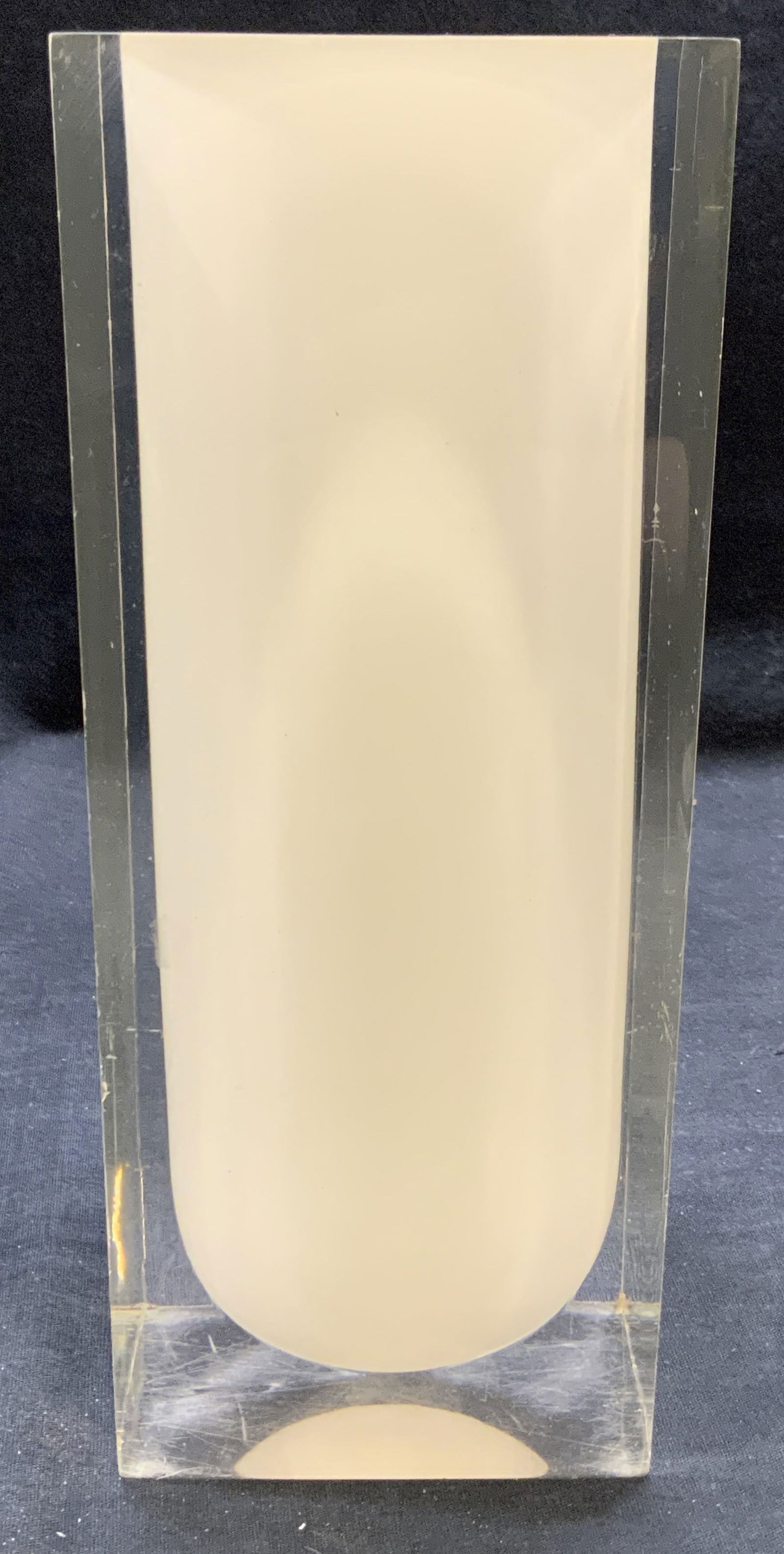 Vintage Clear & White Lucite Vase: Vintage clear and white lucite vase. Geometric shape. Meanders approx. 3 7/8 x 3 7/8 x 9.5 inches. Some surface wear including scratching observed. Vase, clear vase, white vase, lucite vase, geometric