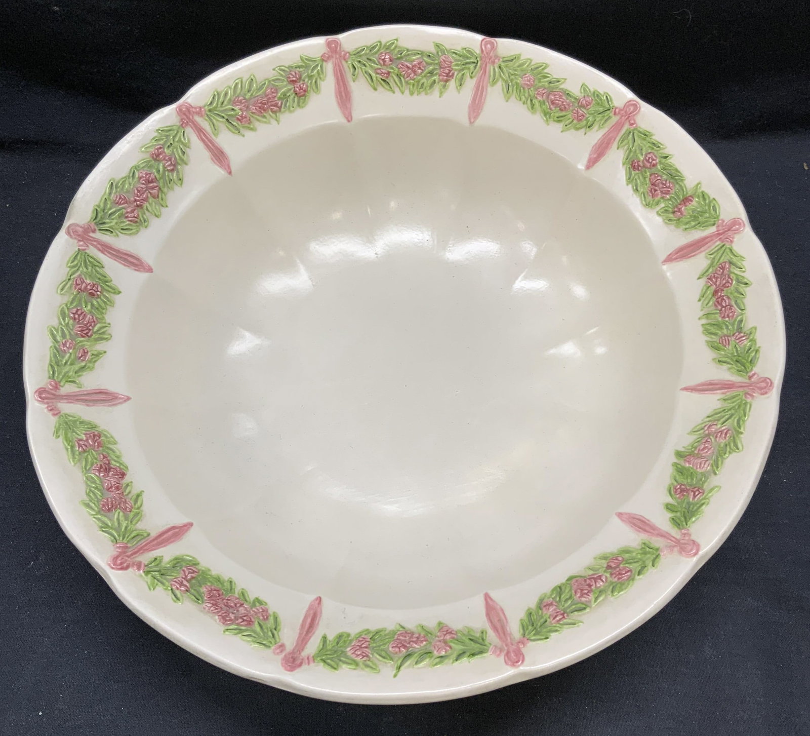 Vintage White Ceramic Floral Bowl, 13 Inches: Vintage white ceramic bowl with raised floral motif rim in green and pink. Measures approx. 13 x 3.5 inches. Some surface wear including scratching observed. Centerpiece bowl, white bowl, floral bowl,