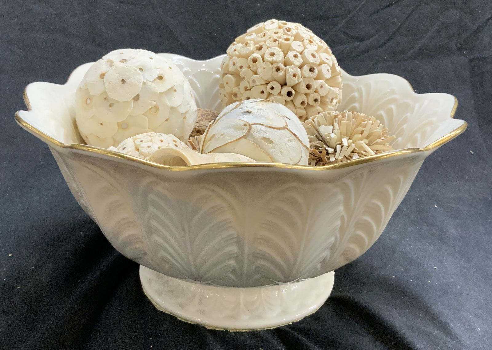 Lenox Porcelain Gilt Rim Vessel W Assorted Decor: Appears to be LENOX (no apparent markings). Lot includes cream toned floral form vessel with gilt rim with assorted decorative objects sitting inside. Vessel is footed. Piece has leaf relief detail. I