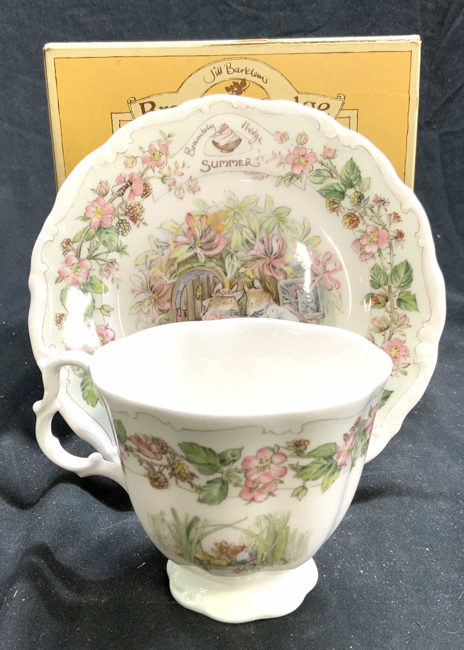 ROYAL DOULTON SUMMER Porc Teacup & Saucer W Box: Box reads JILL BARKLEM BRAMBLY HEDGE ROYAL DOULTON. Lot includes teacup, plate, and matching saucer. Each piece is porcelain. Depicts mice, and has multi toned floral and leaf detail. Lot includes ori