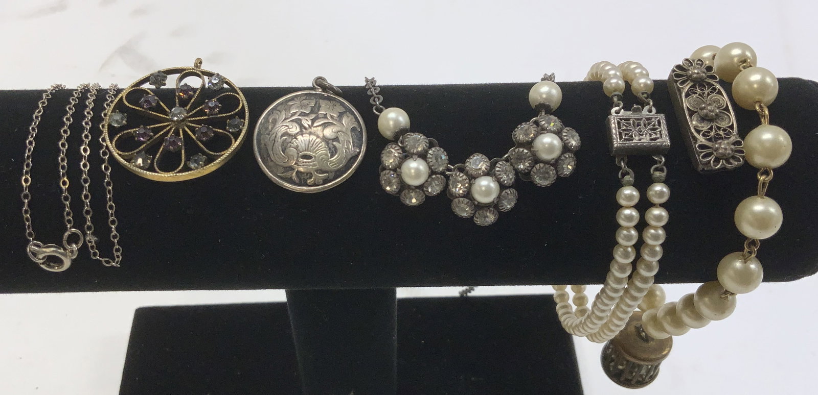 7 Sterling Silv Jewelry/Clasps, Faux Pearl Jewelry: Lot of vintage jewelry . Sterling silver items have been tested with the PuriTEST kit and weight approx .35 ozt Sterling silver art nouveau floral pendant , 1 in. Dainty sterling silver cable chain, 1