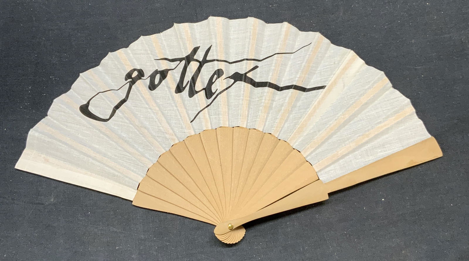 Gottex Wood & Linen Folding Fan: Gottex wood folding fan. Fan material feels like linen. Measures approx. 16 inches wide. Some wear to material consistent with exposure. Fan, folding fan, wood fan, linen fan, Gottex fan, collectible