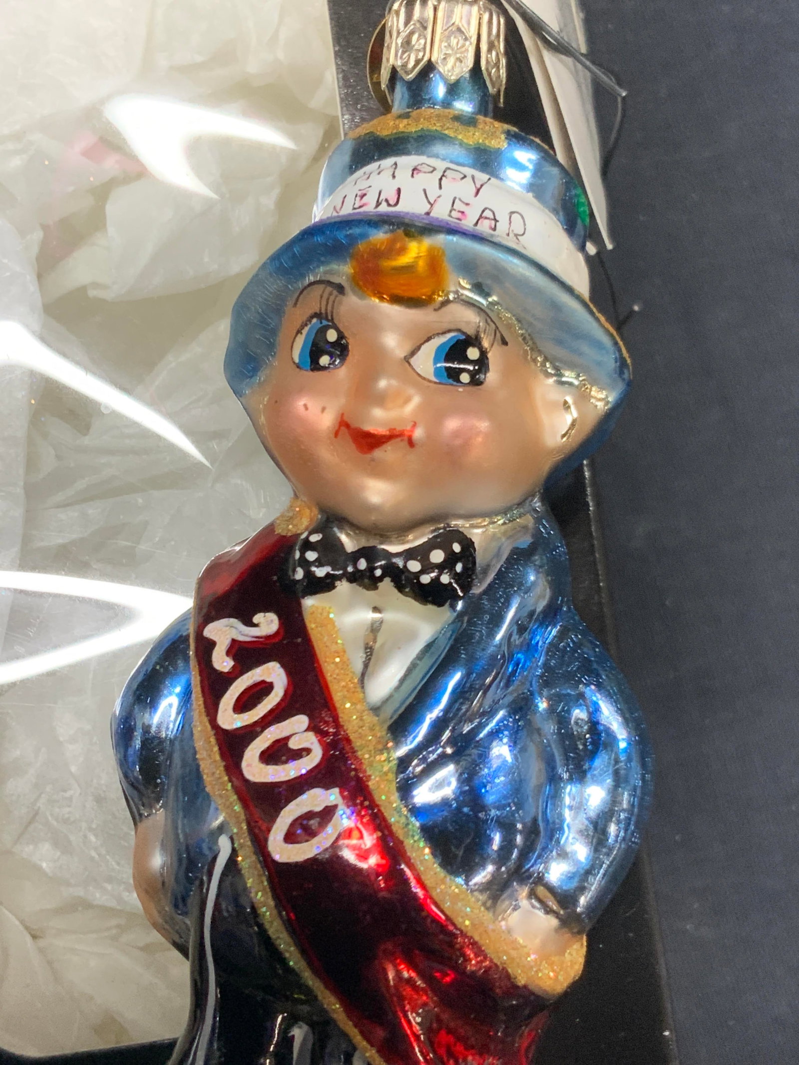 Christopher Radko Baby New Year Glass Ornament: New in box, Baby new year for the year 2000. Comes in Christopher Radko box. Box is approximately 7 x 3 inches and ornament measures 4 inches long Minor wearing to box Christmas ornament. Glass orname