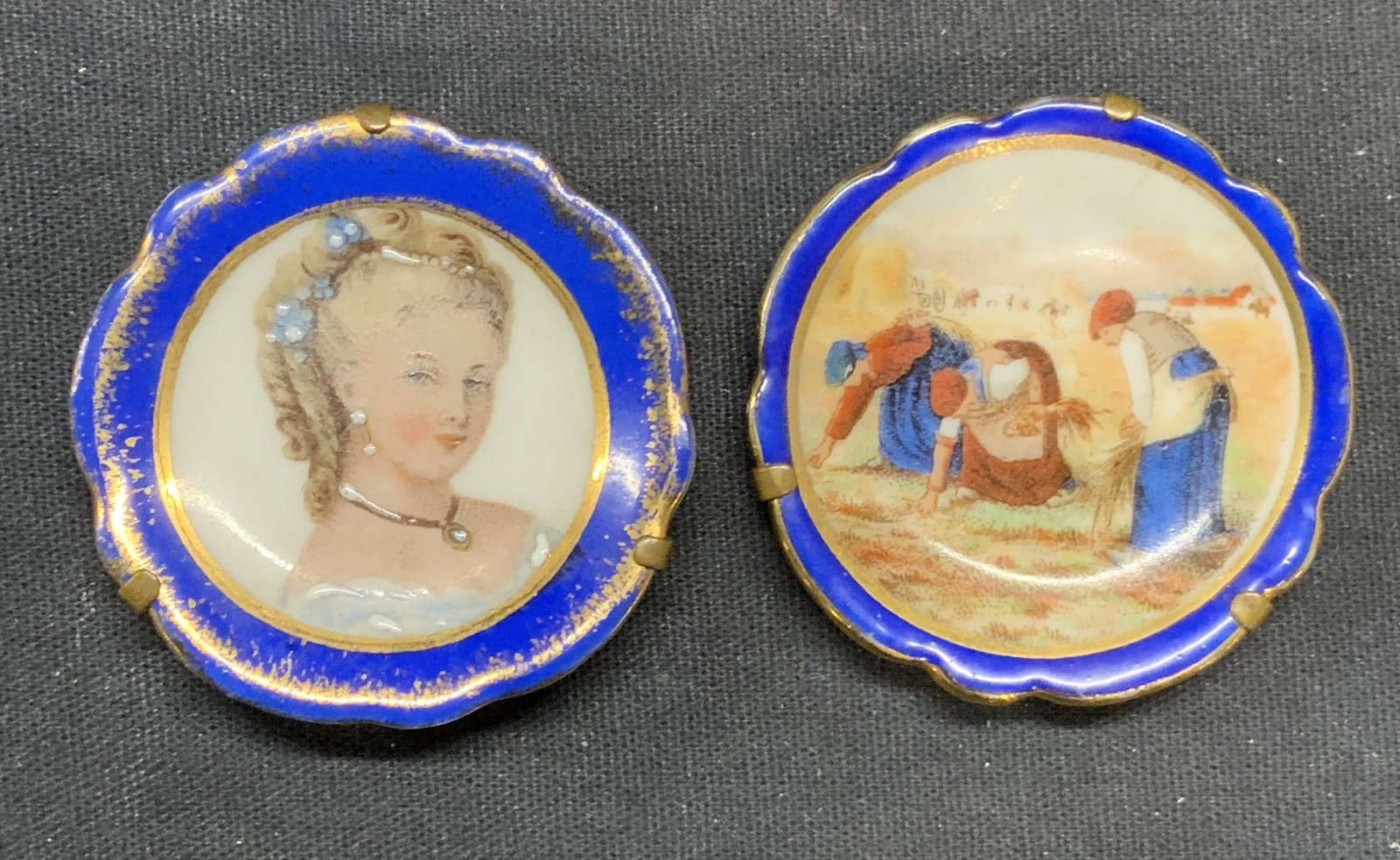 2 Vintage Limoges France Porcelain Figural Plates: Lot of 2 vintage miniature Limoges porcelain plates. Hand painted figural motifs with gilt decoration. Measure approx. 1.75 inches wide each. Trademarked to undersides. Made in France. Both pieces hav