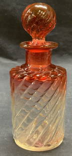 Vintage Pink to Clear Swirl Glass Perfume Bottle: Vintage pink to clear glass perfume bottle with raised swirl motif. Measures approx. 2.5 x 6.25 inches including stopper. Some surface wear including scratching observed. Perfume bottle, glass