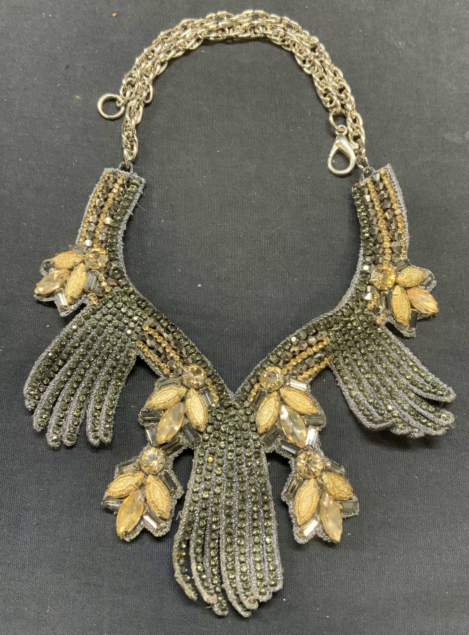 Gold Tone & Gray Crystal Bib Necklace: Silver tone chain with gold and gray tone crystal bib on fabric backing. Drop length approx. 10 inches. Some scratching observed. Estate jewelry, costume jewelry, cocktail jewelry, fashion jewelry, ac