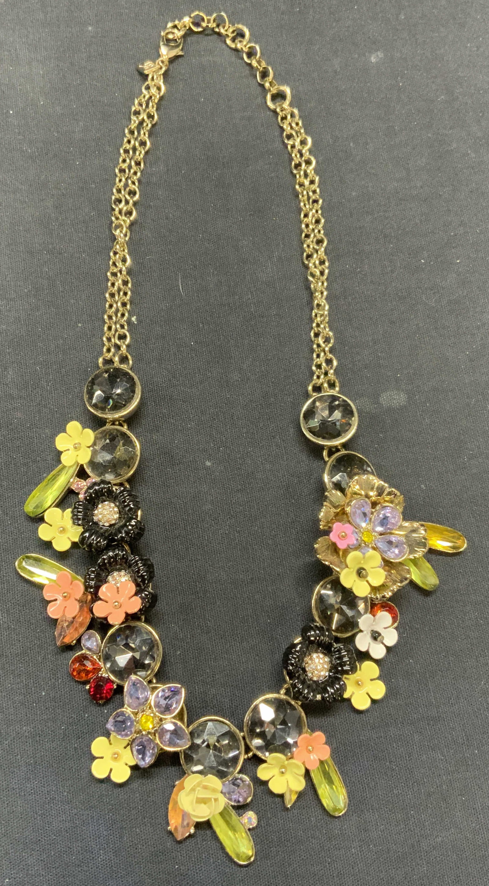 Banana Republic Gold Tn Floral Crystal Necklace: Banana Republic gold tone necklace with floral enamel detail and multi color crystal decoration. Signed on hang tag. Drop length approx. 8.5 inches. Some scratching observed. Estate jewelry, costume j