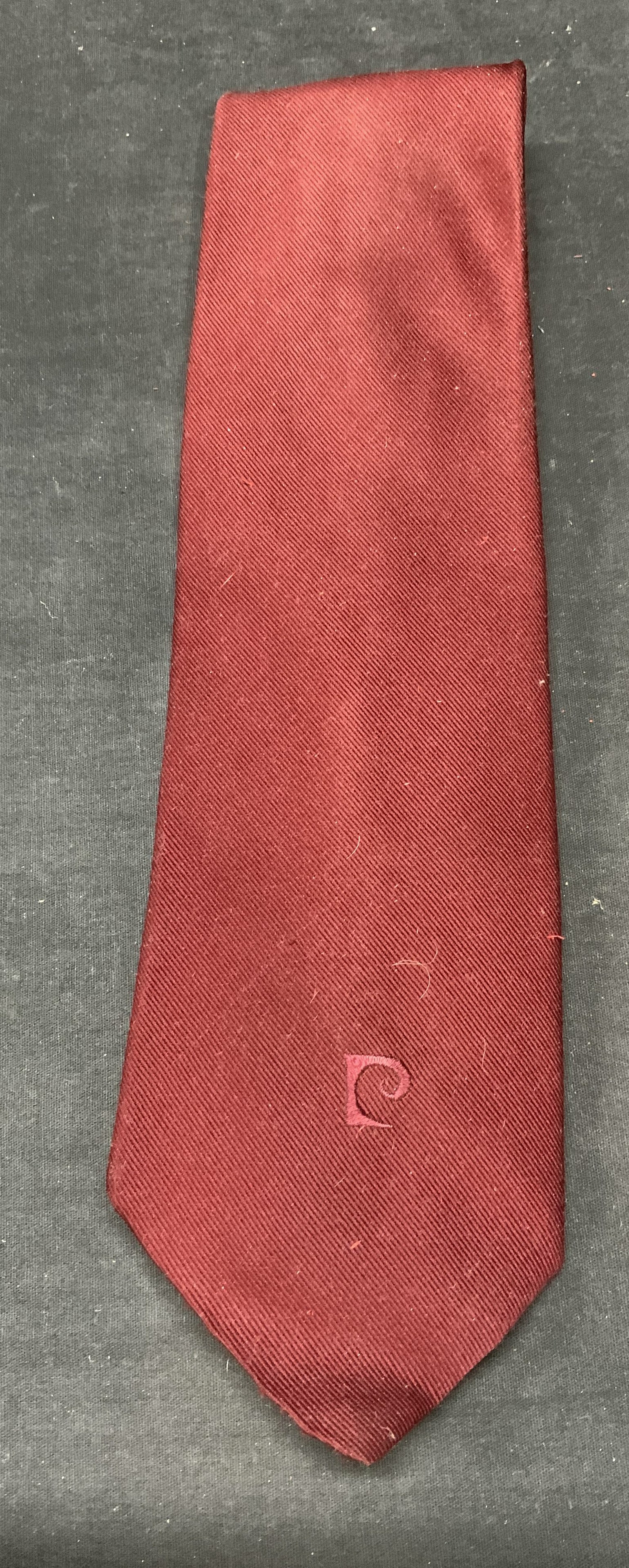Pierre Cardin Burgundy Red Silk Tie: Pierre Cardin burgundy red silk tie. Measures approx. 56 inches long. Some wear to material consistent with exposure observed. Pierre cardin, Pierre Cardin tie, means designer tie, mens designer fashi