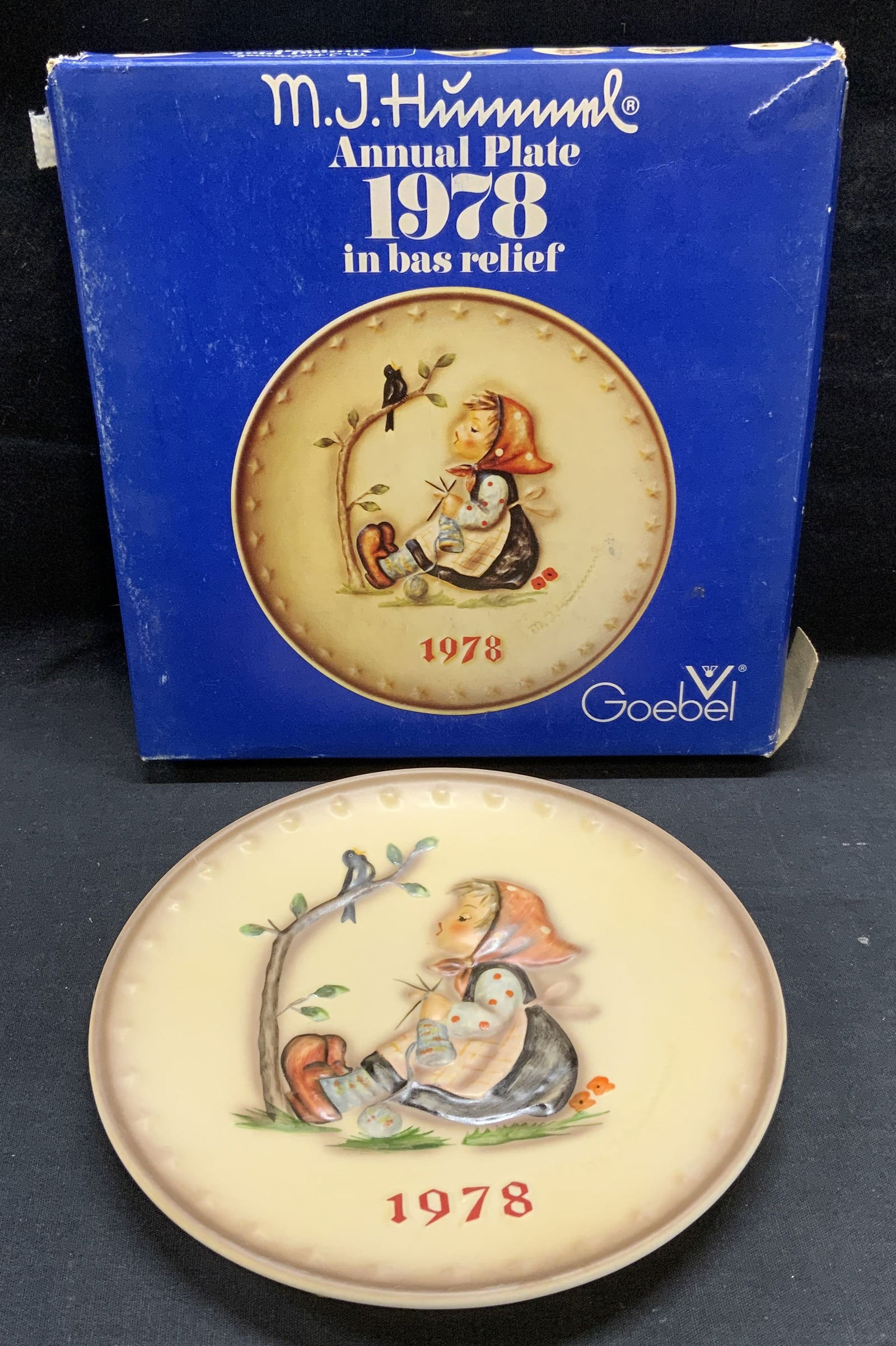 GOEBEL Hummel 1978 Annual Porcelain Plate: GOEBEL MJ Hummel 1978 Annual porcelain plate with original box. Bas relief figural and bird motif. Trademarked to underside. Plate measures approx. 7.5 inches diameter. Box measures approx. 9 x 9 x 2