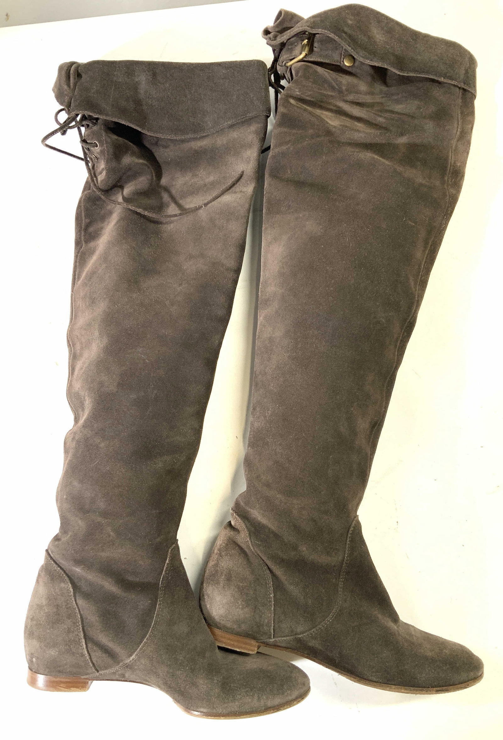 Chloe Suede Boots, Italy: Marked Chloe suede boots with ties on upper rim of boots, marked 35.5 made in Italy. Approx 21 inches long and 9 inches long sole.Moderate wearing to the sole of the boots. luxury designer boots, Chlo