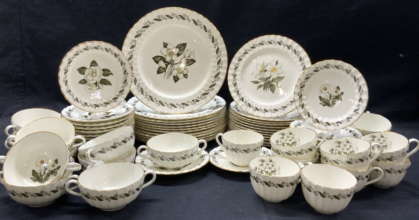 Set 48 Royal Worcester Bone China England: Partial set of 48 Royal Worcester fine bone China. Each marked Royal Worcester fine bone China, made in England. Engadine. Dishes and plates have center flowers in white with green leaves and motifs o