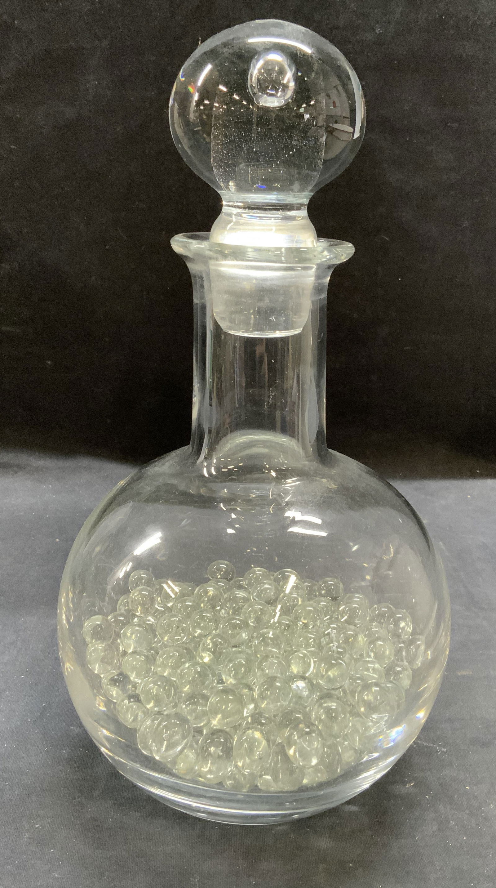 Vintage Hand Blown Glass Decanter: Vintage hand blown glass decanter. Thick walled glass, piece has weight. Measures approx. 5.5 x 11.5 inches including stopper. Lot includes decorative glass marbles. Some surface wear including scratc