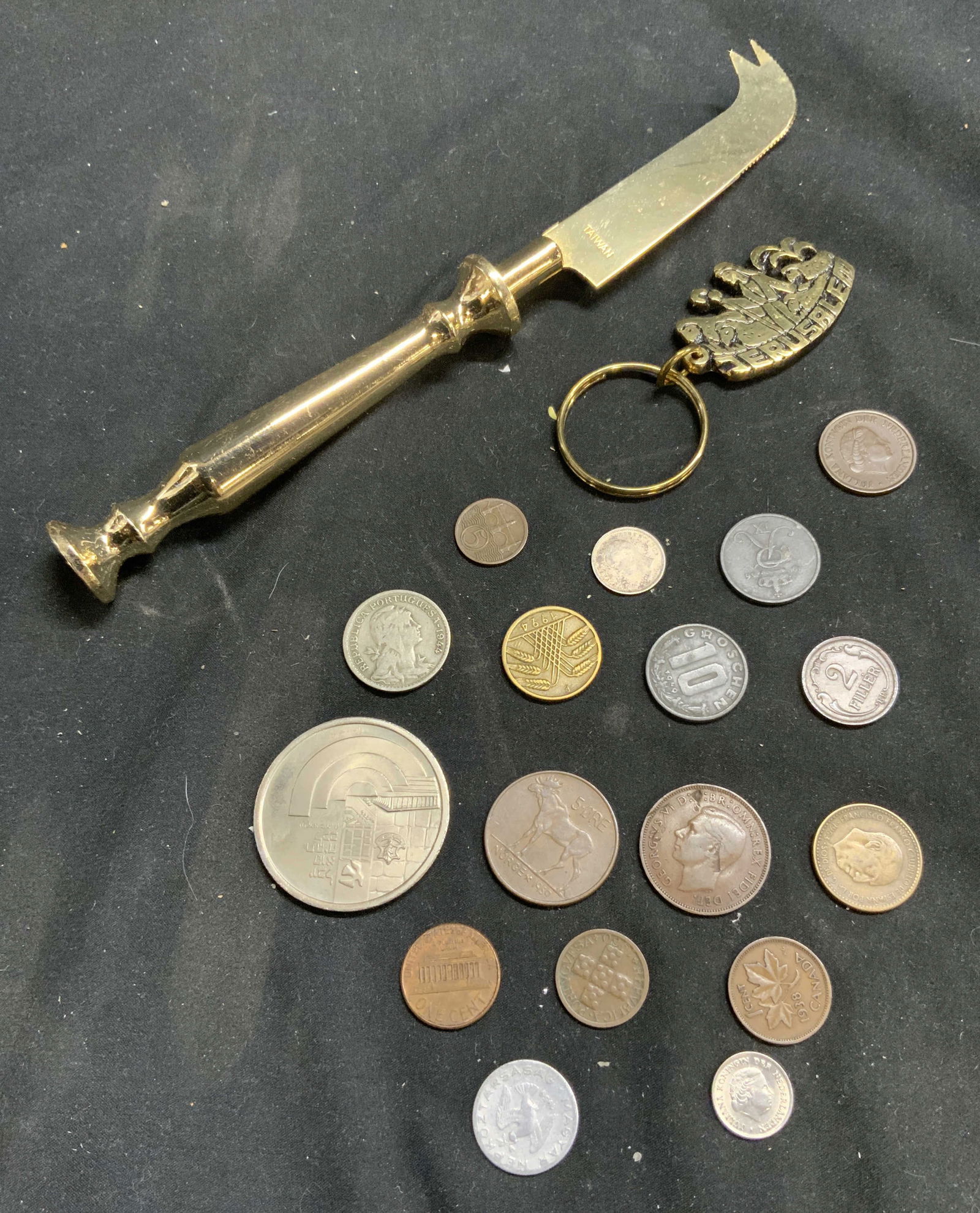 Lot 19 Cheese Knife Jerusalem Keychain & Coins: Lot includes 17 Coins 1 cheese knife & 1 keychain. Keychain reads JERUSALEM. Cheese knife and keychain are gilt metal. Knife measures approximately 8 inches long. Knife, cheese knife, keychain, Jerusa