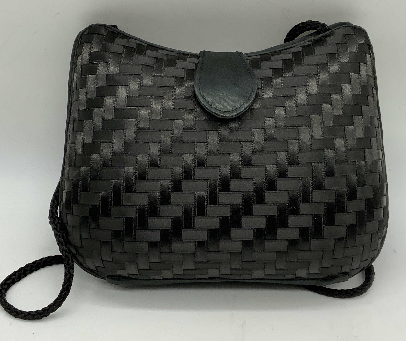 Vintage DELILL Black Woven Satin Handbag: Vintage DELILL Creations black woven satin ribbon handbag. Signed to interior. 1 zippered pocket to interior. Measures approx. 7 x 2.5 x 5.5 inches. Some wear to material consistent with exposure. DEL