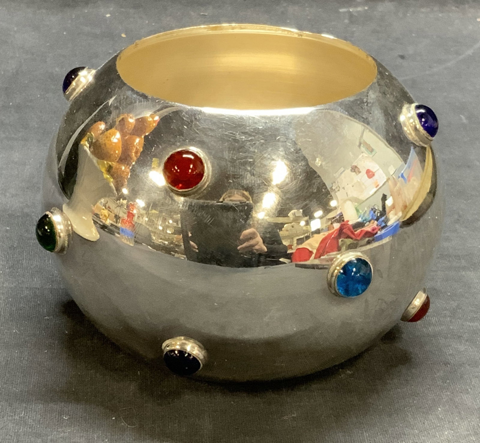 Vintage Silver Tone Cabochon Vessel: Vintage silver tone vessel with multi colored jeweled cabochon decoration. Measures approx. 4.5 x 3.5 inches. Some surface wear including scratching observed. Silver tone vessel, silver tone vase, jew