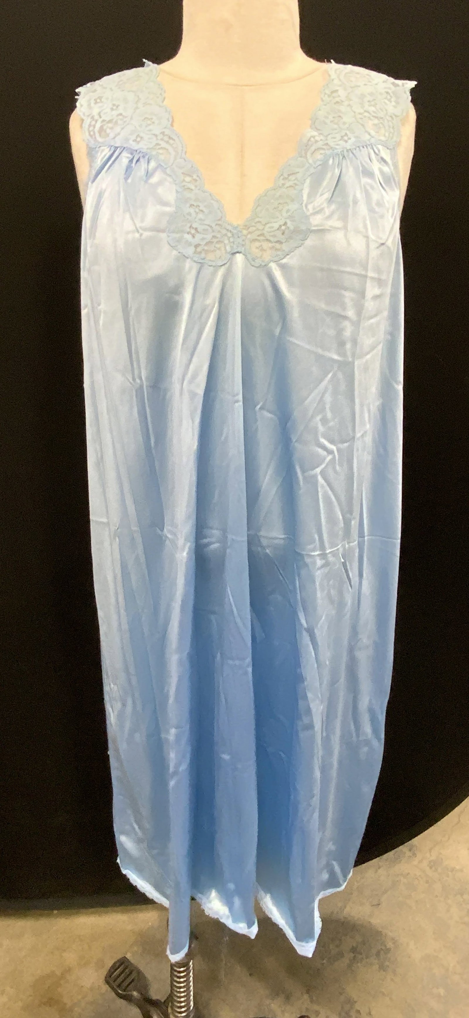 Vintage Vanity Fair Blue Nightgown, USA: Vintage Vanity Fair blue nightgown. Sleeveless with v neck and lace detail. Size M. Synthetic material. Made in USA. Some wear to material consistent with exposure. Vanity fair, vanity fair nightgown,