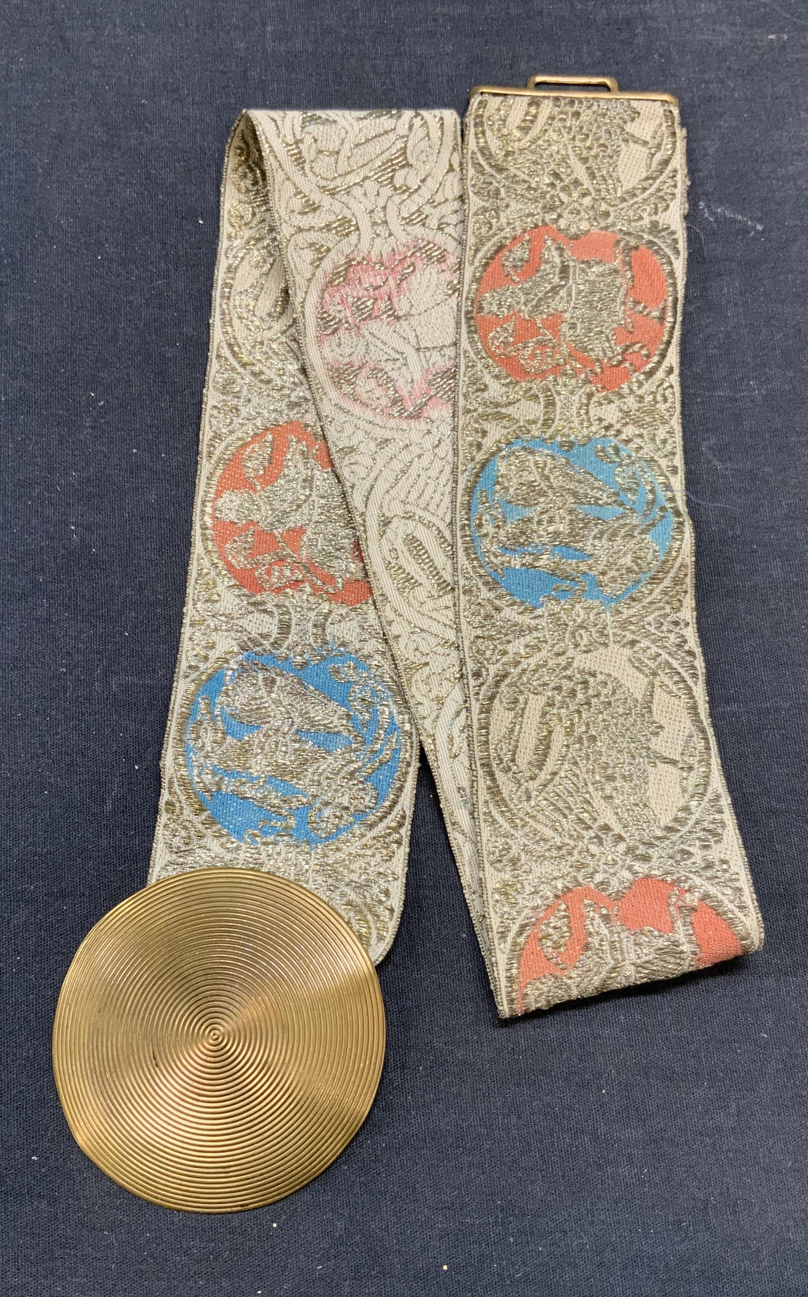 Vintage Embroidered Figural Motif Belt: Vintage belt with embroidered figural and mythological motifs. Gold tone buckle. Measures approx. 28 inches long. Some wear to material consistent with exposure. Belt, vintage belt, embroidered belt, 