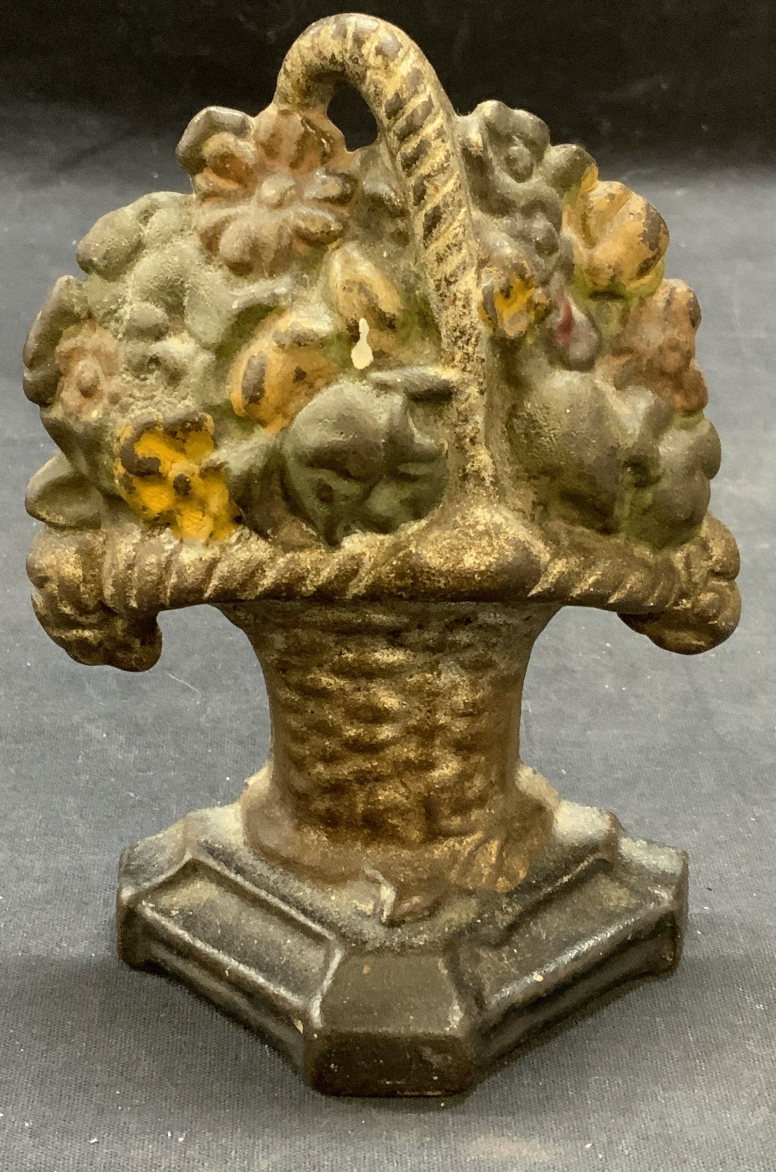 Vintage Flower Basket Cast Iron Door Stop: Vintage, possibly antique, cast iron flower basket door stop. Piece has weight. Measures approx. 4 x 1.75 x 5.75 inches. Some surface wear including loss to paint and scratching observed. Door stop, f