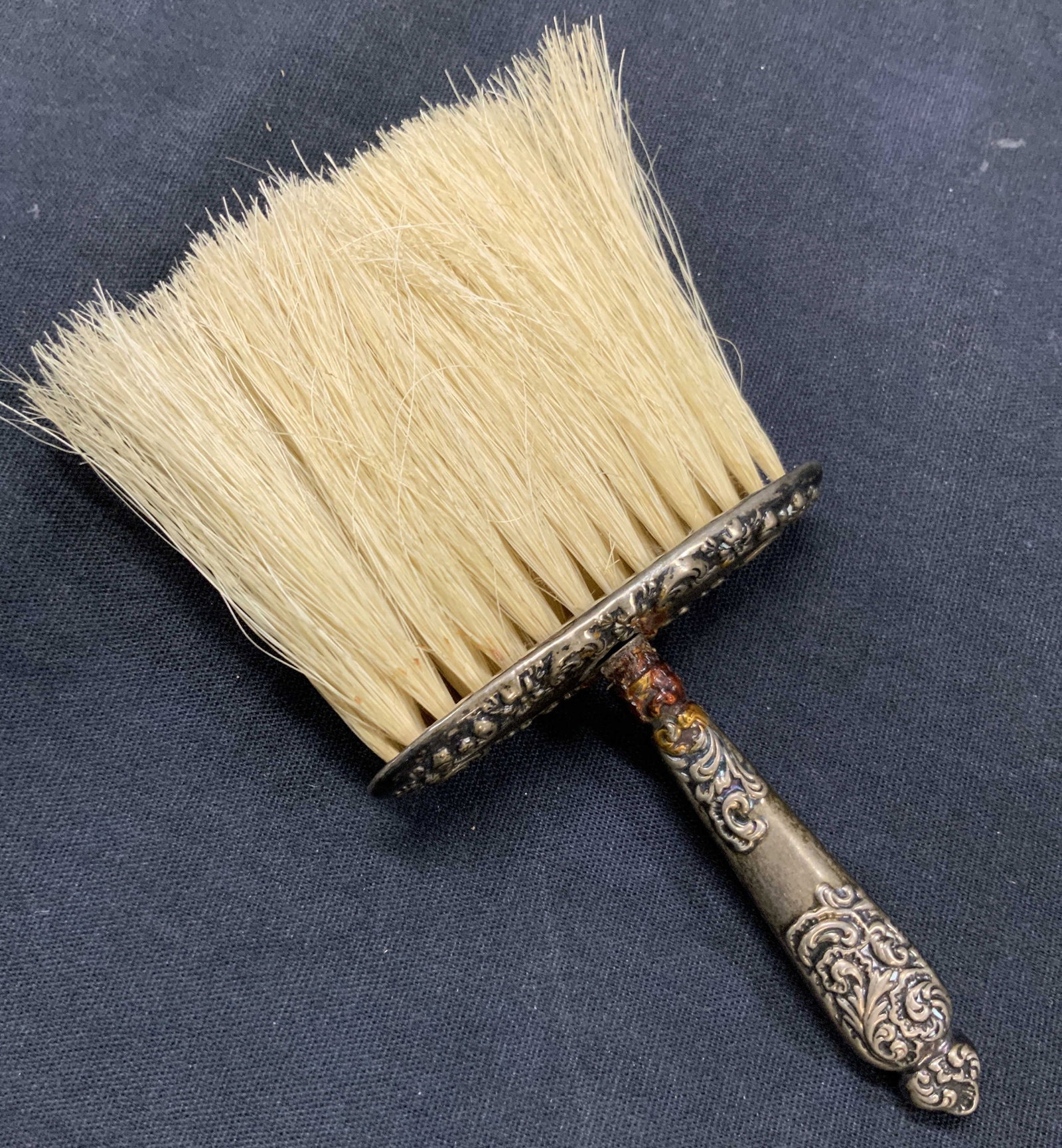 Vtg Sterling Silver Table Brush As Is: Vintage sterling silver table or shoe brush with ornate scroll embossing on handle. Marked sterling on handle. Approx 6 inches long Total weight of sterling 0.64 ozt Moderate blemishes to brush and ha