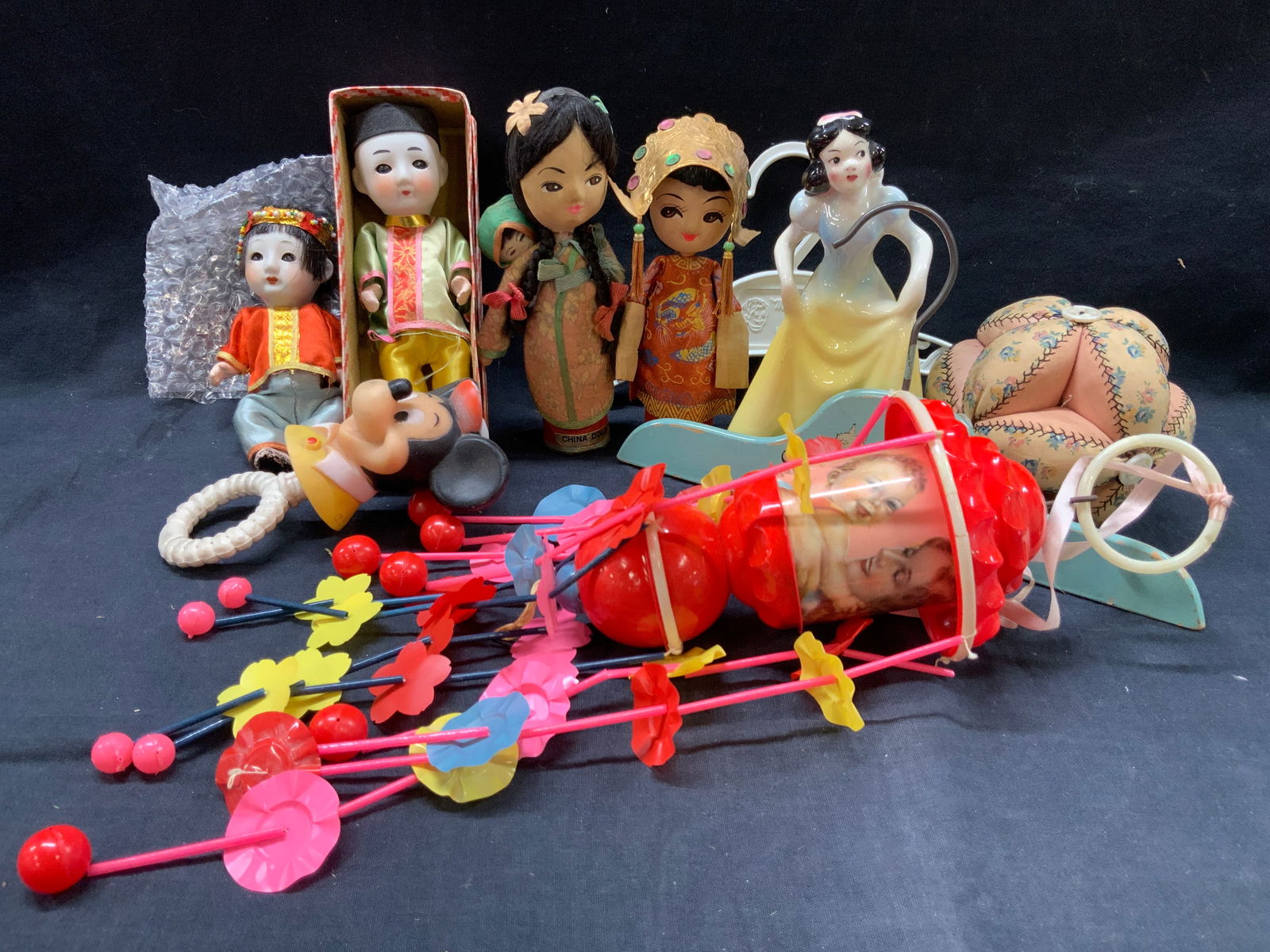 Lot 10 Vtg Fabric Dolls & Baby Toys: Lot of 10 vintage toys and baby accessories. 2 porcelain china dolls, 2 fabric crafted china dolls with hand painted faces. 1 porcelain coin bank of Snow White at 7 inches tall. 2 baby clothes hangers