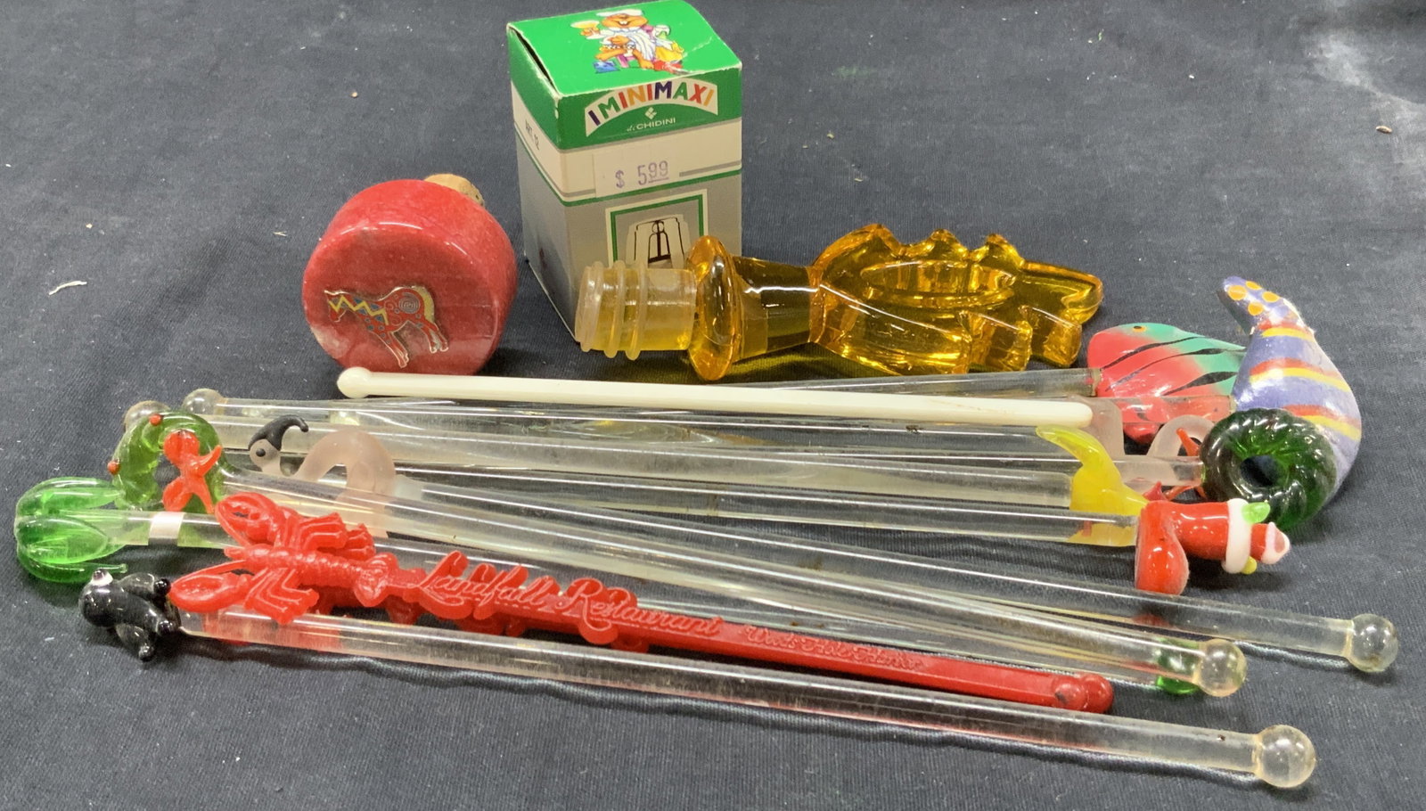 Lot 16 Vtg Barware Accessories: Lot of 16 vintage Barware accessories. 13 glass cocktail stirrers with glass Christmas and tropical ornaments on ends. 1 amber toned had composite bottle stopper. 1 iminimaxi bottle opener new in box 