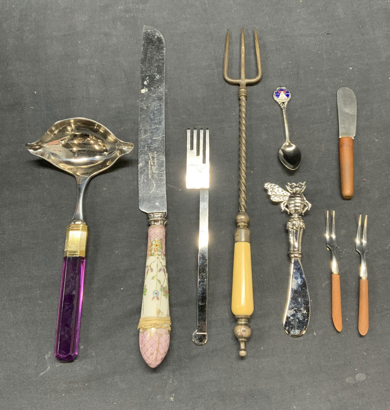 Lot 9 Sterling Silver & Bone Handle Utensil +: Vintage sterling silver and bone handled serving utensil. Hallmarked on handle. Total weight 122.6 grams. MIKASA purple acrylic handle ladle. Sheffield porcelain handle knife. BISSELL and Wilhite Co s