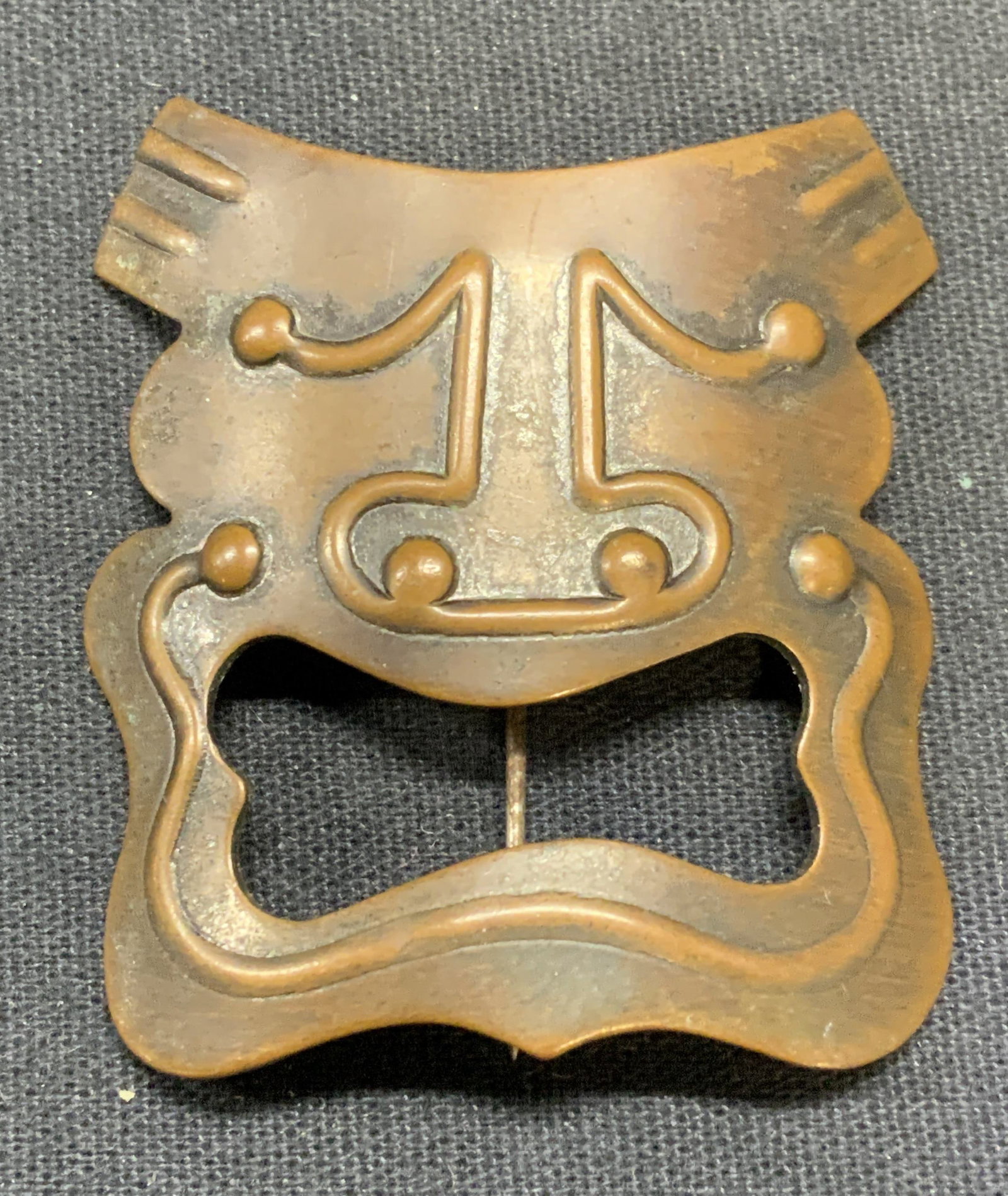 Signed Vintage Handmade Copper Mask Brooch: Vintage handmade copper tribal style mask brooch. Signed to underside illegibly. Hinge pin to underside. Measures approx. 1.75 x 1.75 inches. Some scratching observed. Estate jewelry, costume jewelry,