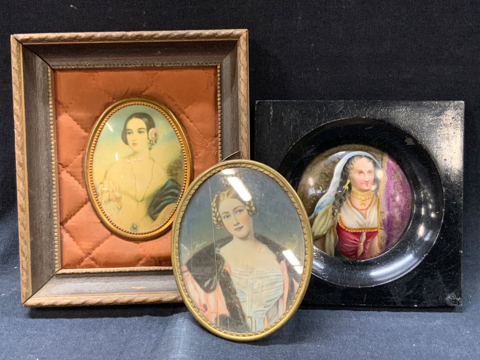 3 Vtg Sgd Lithos & Paintings On Bone & Porcelain: Lot of 3 vintage, possibly Antique portraits, with 1 being a lithograph of a woman with black hair and a white gown, frame in wooden frame with orange quilting. Approx 5.5 x 4.75 inches and Art measur