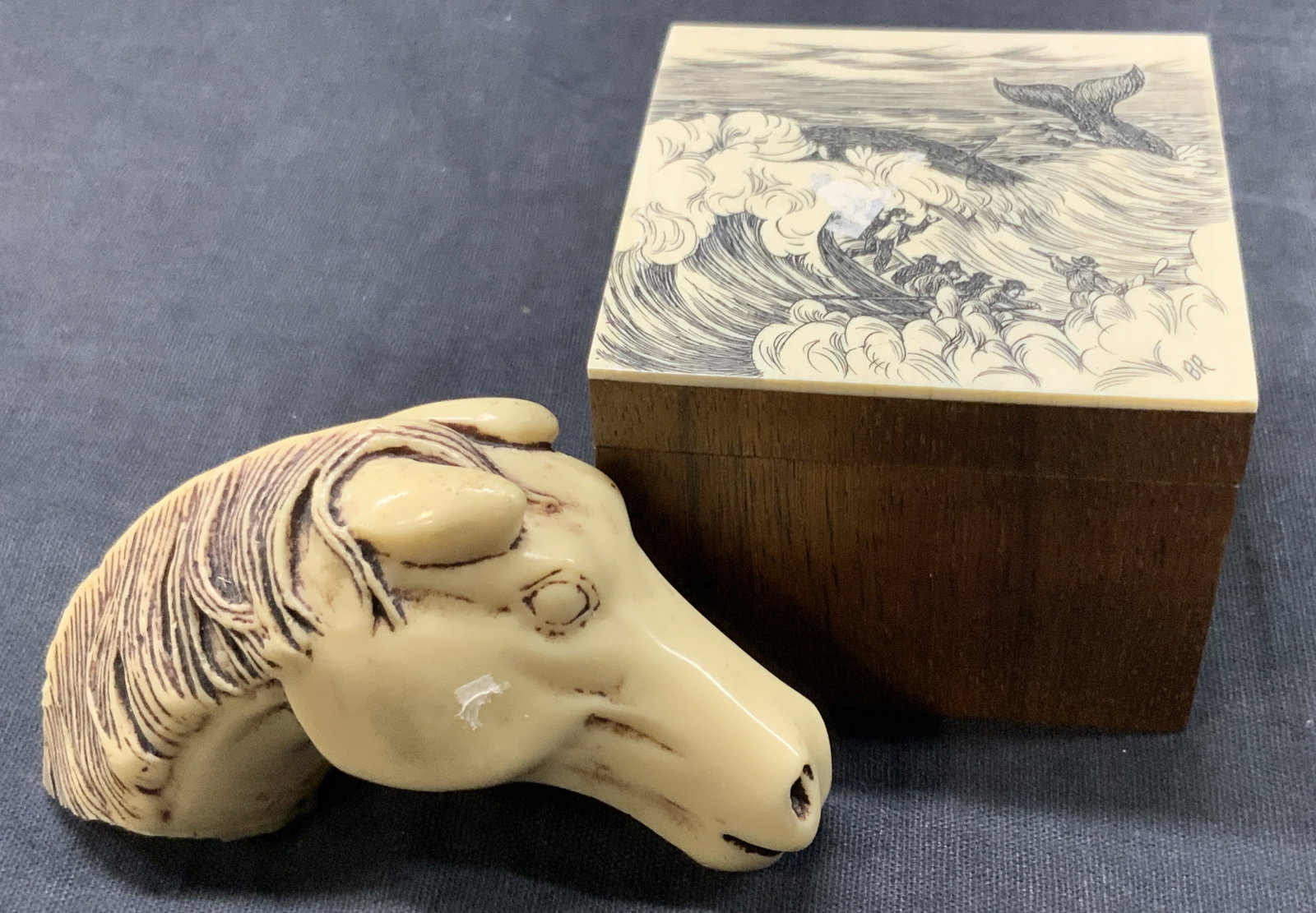 Lot 2 Scrimshaw Style Accessories, Box & Horse Fig: Lot of 2 scrimshaw style accessories. 1 wooden trinket box, possibly a compass box with an etched bone or hard composite lid depicting men at sea with a whale breaching the waves, approx 2.5 x 2,5 x 2