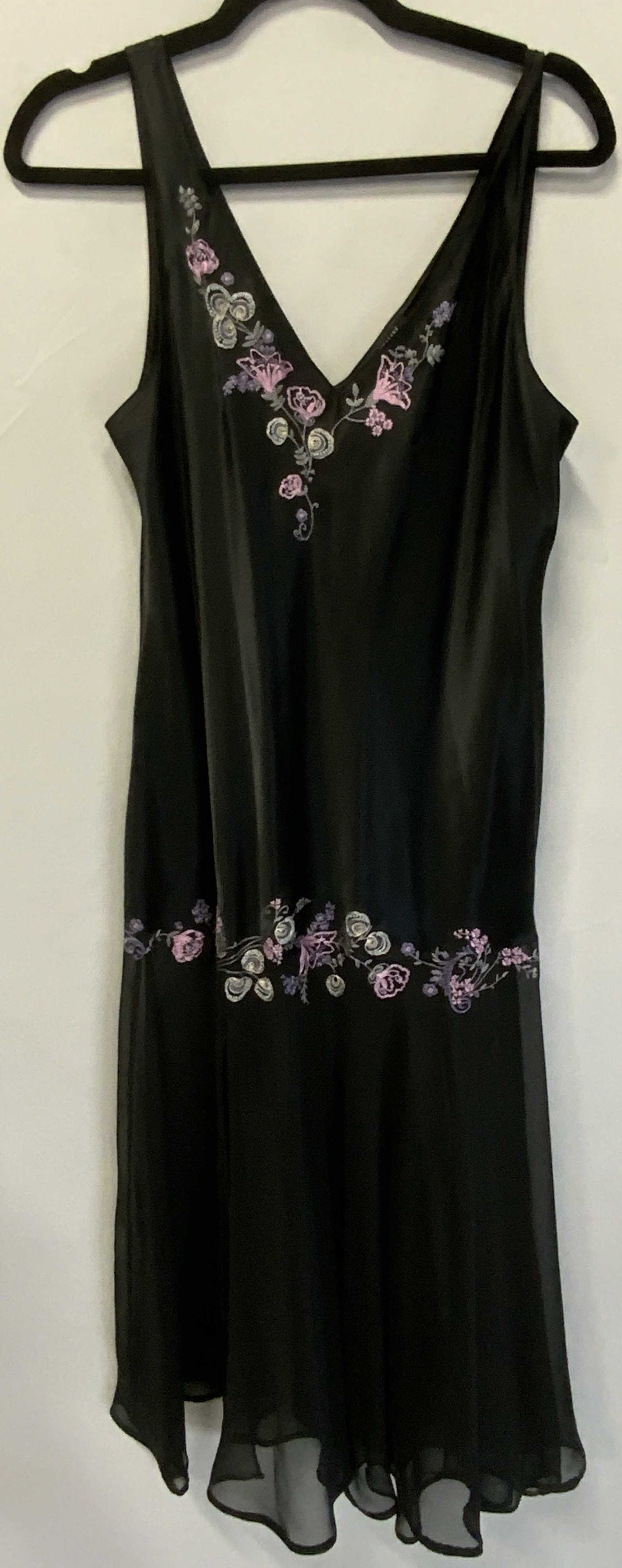 FANTASIES MORGAN TAYLOR Black Embroidery Dress: A black semi sheer dress with colorful floral embroidery and beadwork accents. Tag reads FANTASIES MORGAN TAYLOR, L, Fab: 100% Polyester Exclusive of Decoration Made in China WPL 8046. Length measured