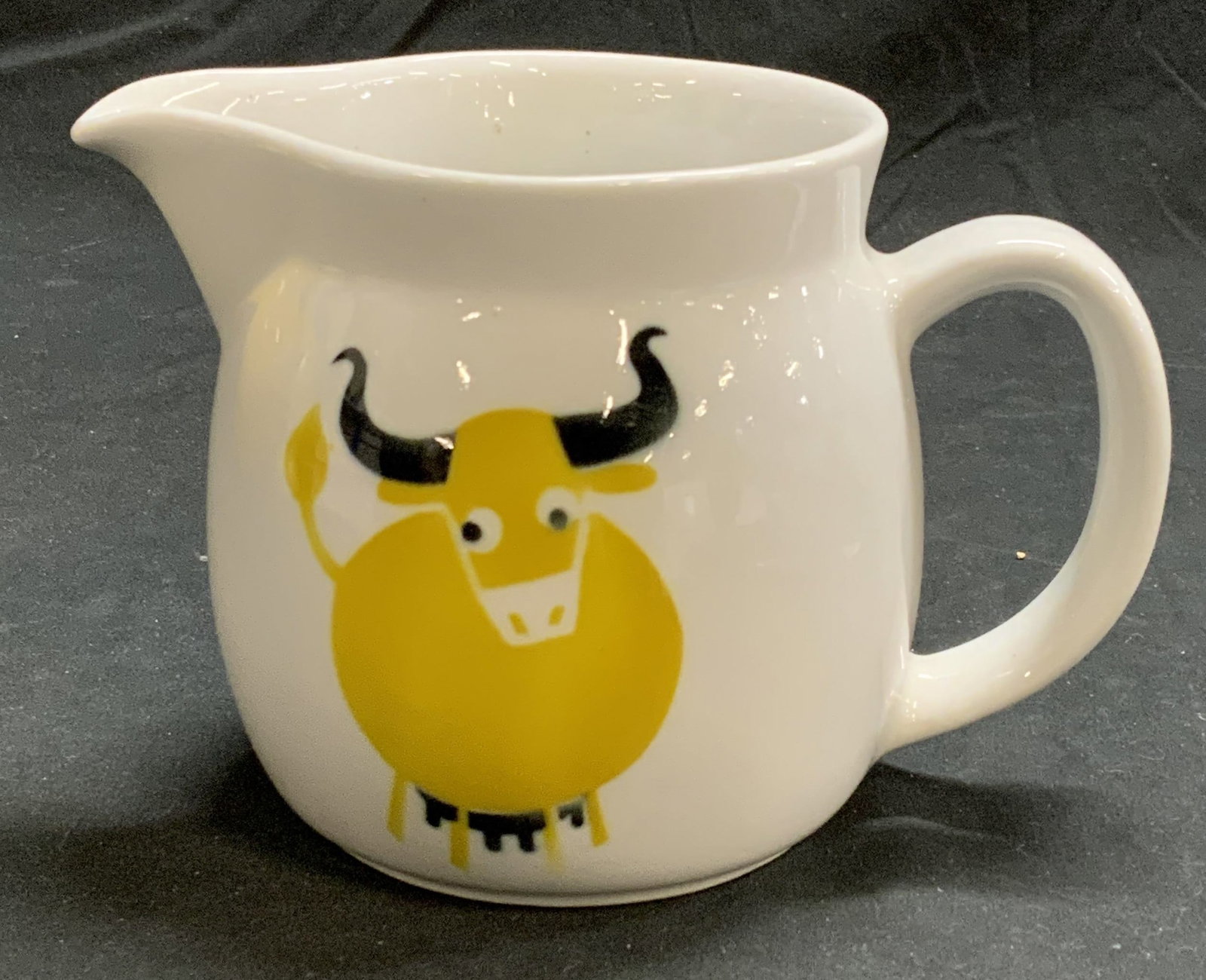 ARABIA FINLAND Porcelain Bull Creamer: Arabia Finland porcelain creamer with bull motif. Trademarked to underside. Measures approx. 6.25 x 3.75 x 4 inches. In good condition. Arabia Finland, Arabia Finland creamer, porcelainware, porcelain