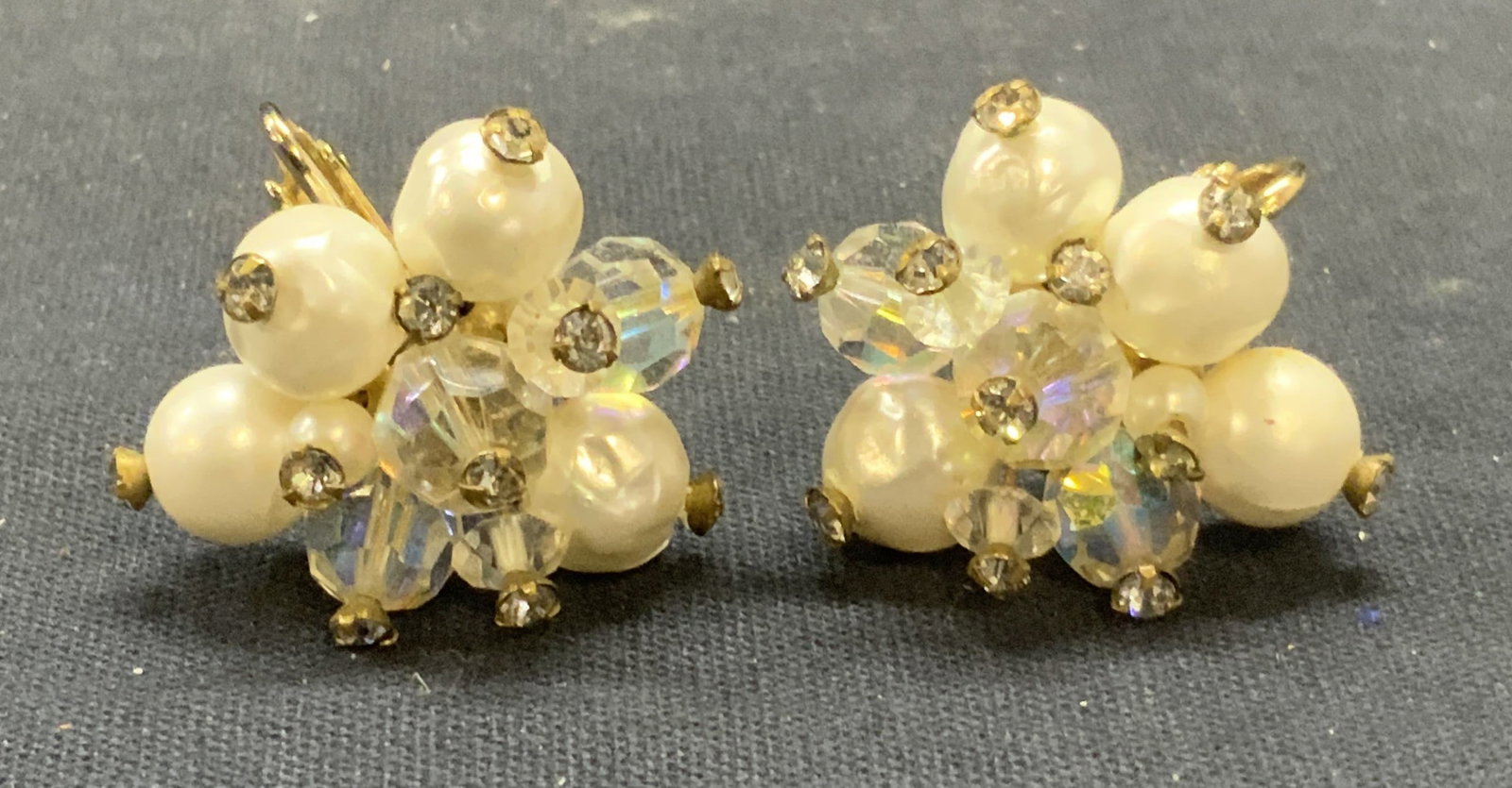 Vtg Vendome Faux Pearl Crystal Earrings: Vintage Vendome gold tone clip on earrings with beaded faux pear, and colorless crystal decoration. Signed on backing. Measure approx. 1 inch wide. Some surface wear including scratching observed. Est