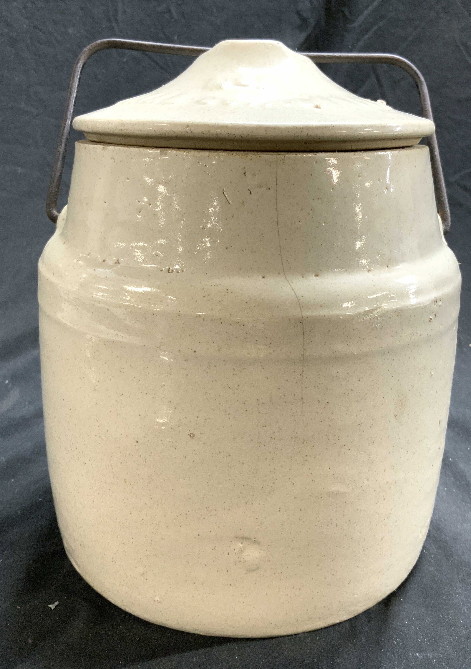 Vintage Ceramic Pickling Crock W Lid & Handle: Pickling crock is vintage. Piece is cream toned. Crock includes lid and metal handle. Crock measures approximately 10 inches tall 7 inches wide. Crock, ceramic pickling crock, pickling crock, vintage 