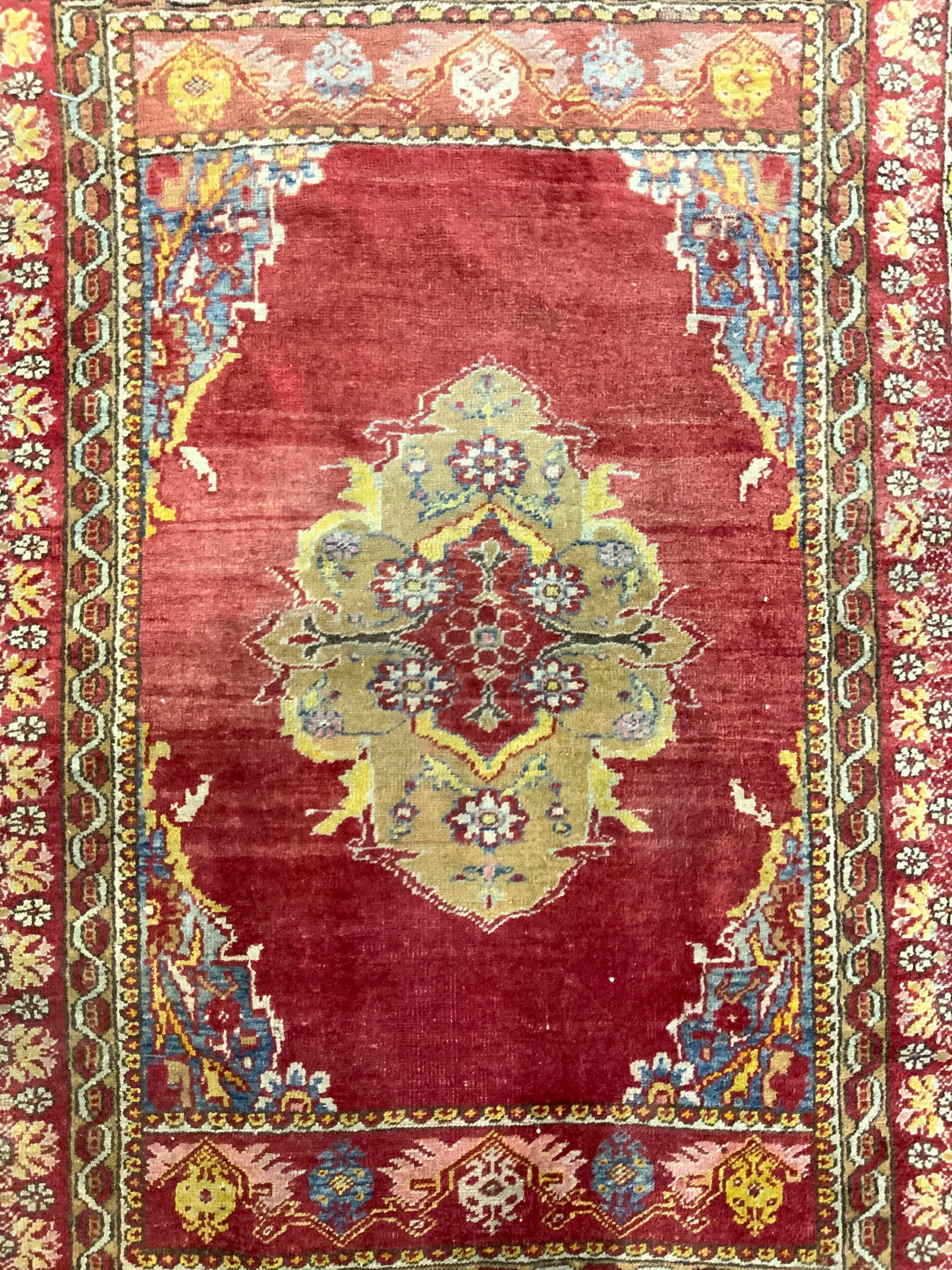 Antique Handmade Persian Wool Rug: Rug is handmade and wool. Piece appears to be antique possibly vintage. Rug has intricate multi toned floral motif detail. Measures approx 63 inches long 43 inches wide. Rug, Persian rug, handmade rug