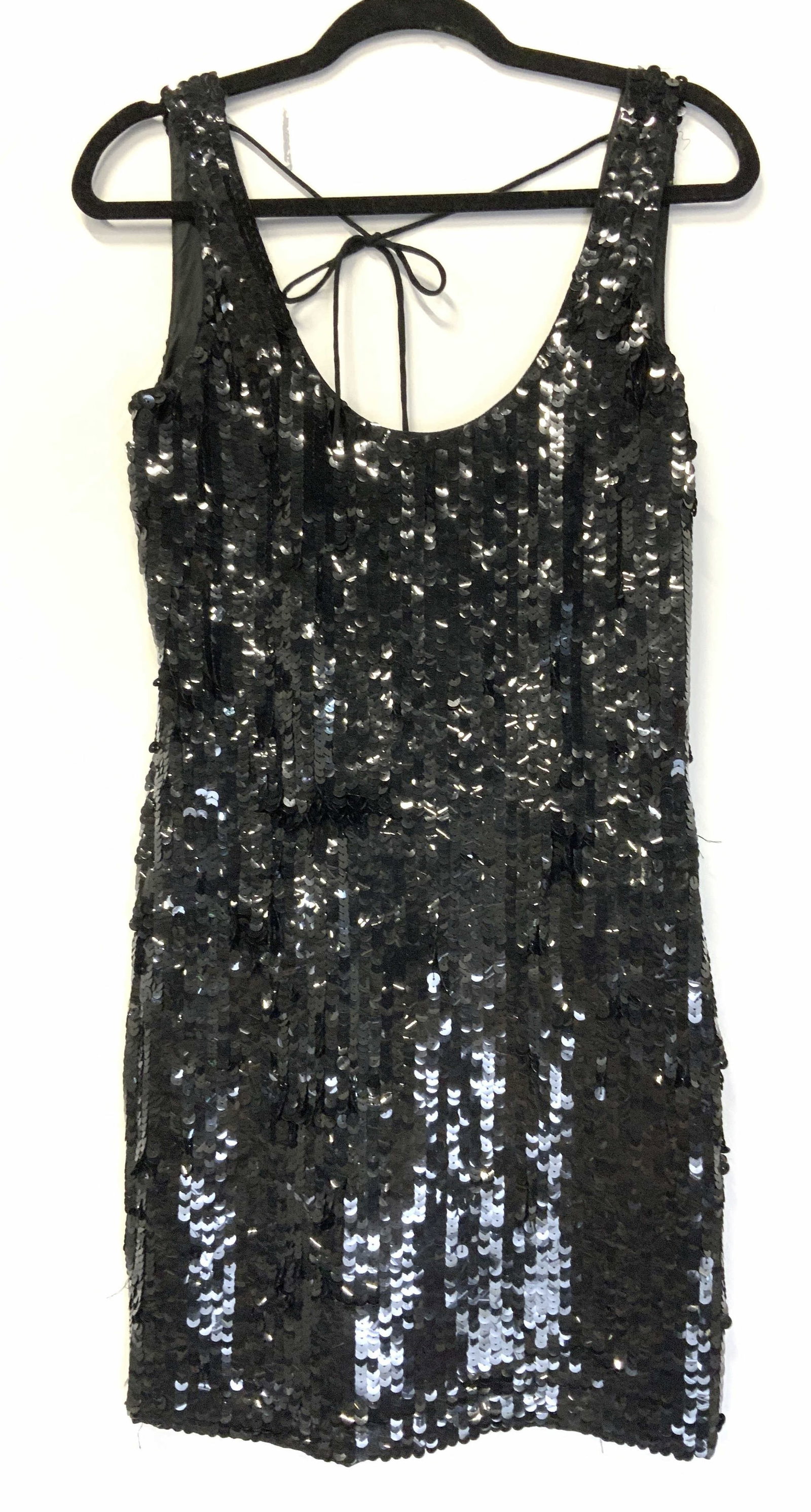 Black Sequin Sleeveless Dress: Low back sexy sequin dress, 35 in long. Back tie attached to shoulders. waist 28 in., hips 32/34 in. Inner dress slip attached to dress. A few loose strings can be sniped. Minimal sequin loss. No bran