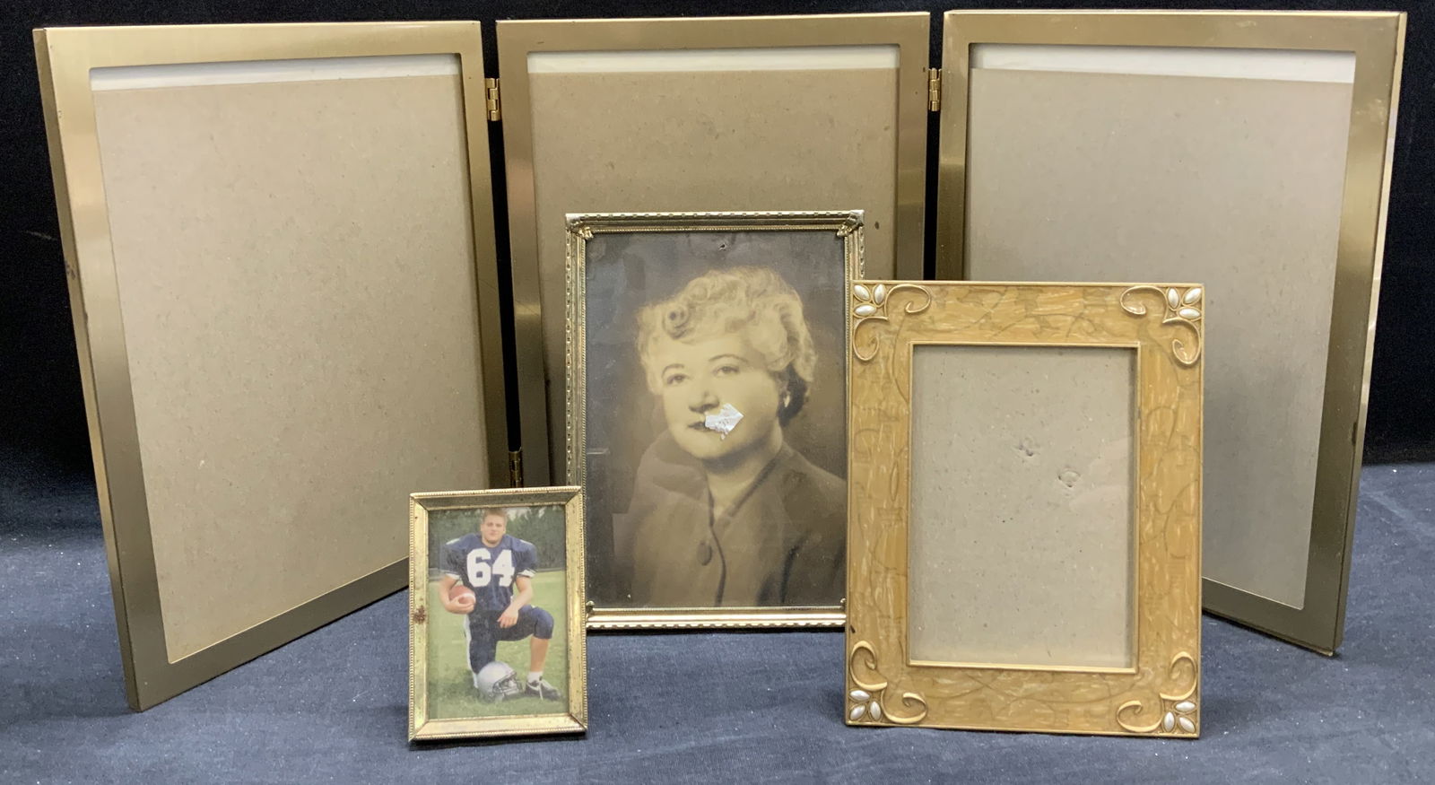 Lot 4 Trifold & Gold Tone Picture Frames: Lot 4 gold tone picture frames. 1 trifold frame, 2 gold tone embossed frames, and Connoisseur 1 gold tone enamel frame. Largest measures approx. 10.5 x 24.5 inches. All pieces have surface wear includ